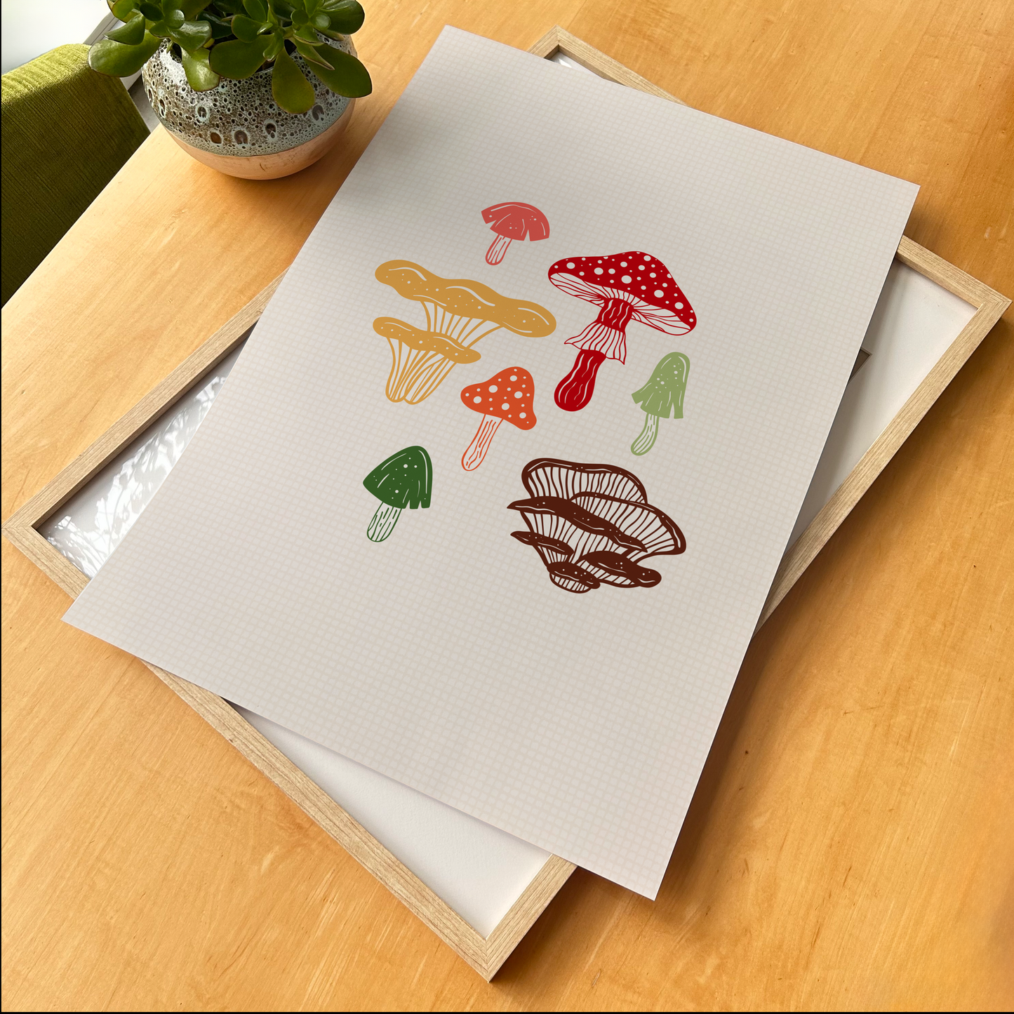 An illustrated print featuring 7 different mushrooms, in autumnal colours, shown in a frame.