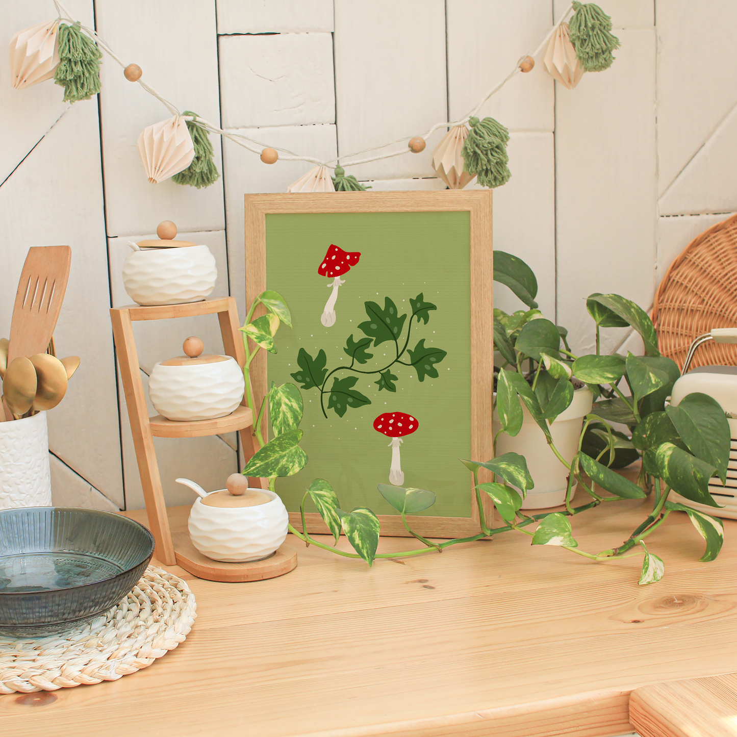An illustration of two toadstool mushrooms and some ivy, on a green background.