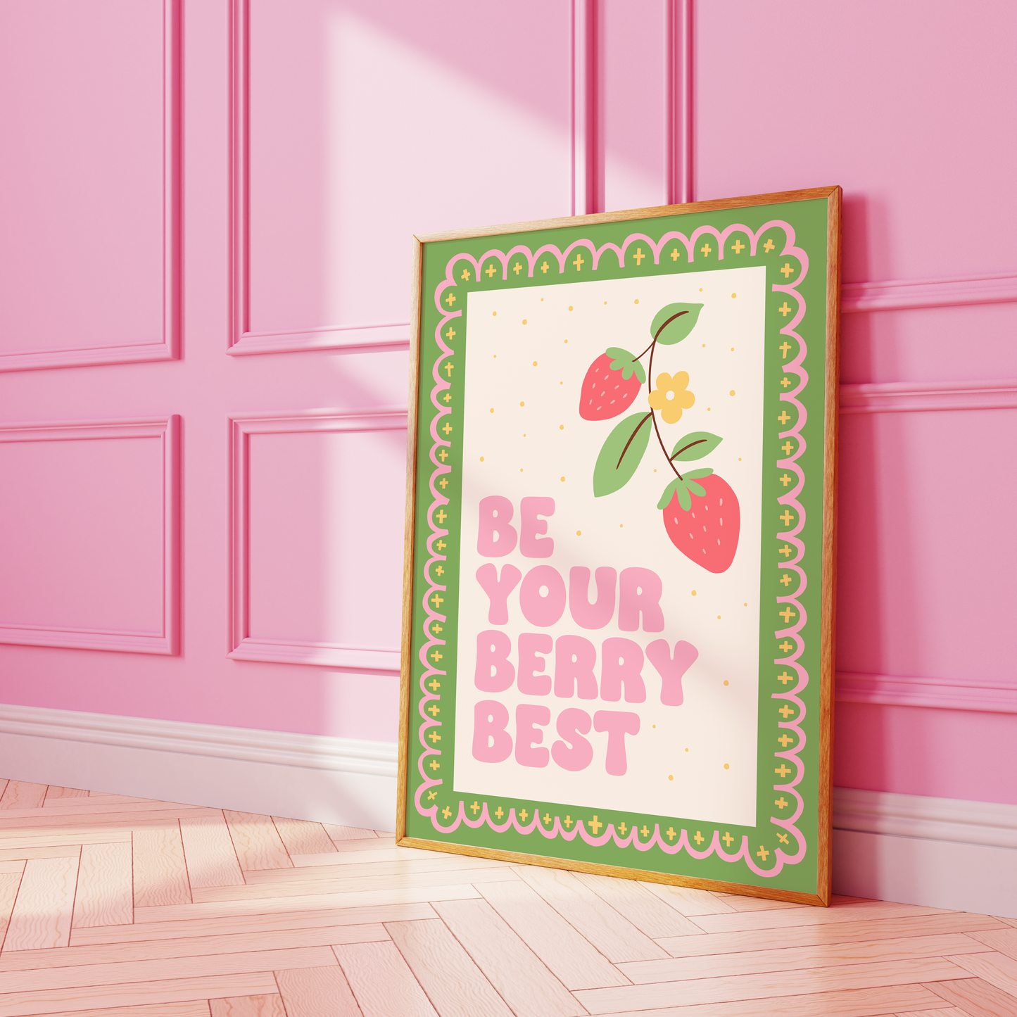 A print with a green and pink illustrated border, and a quote saying 'be your berry best' in a pink chunky font. Next to the quote is an illustration of a strawberry plant.