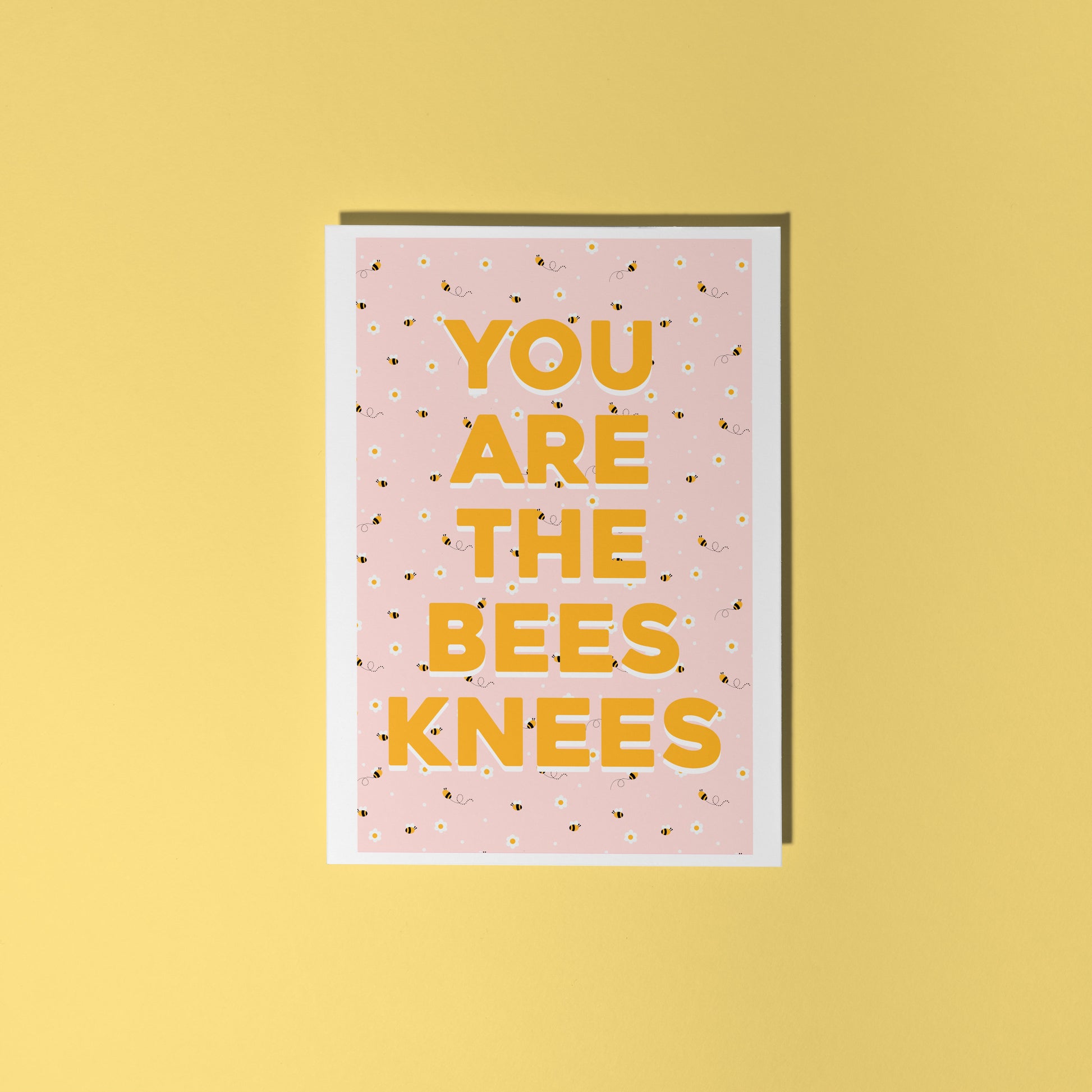 a card with a repeating pattern of buzzing bees, and text that reads 'you are the bees knees' in yellow.