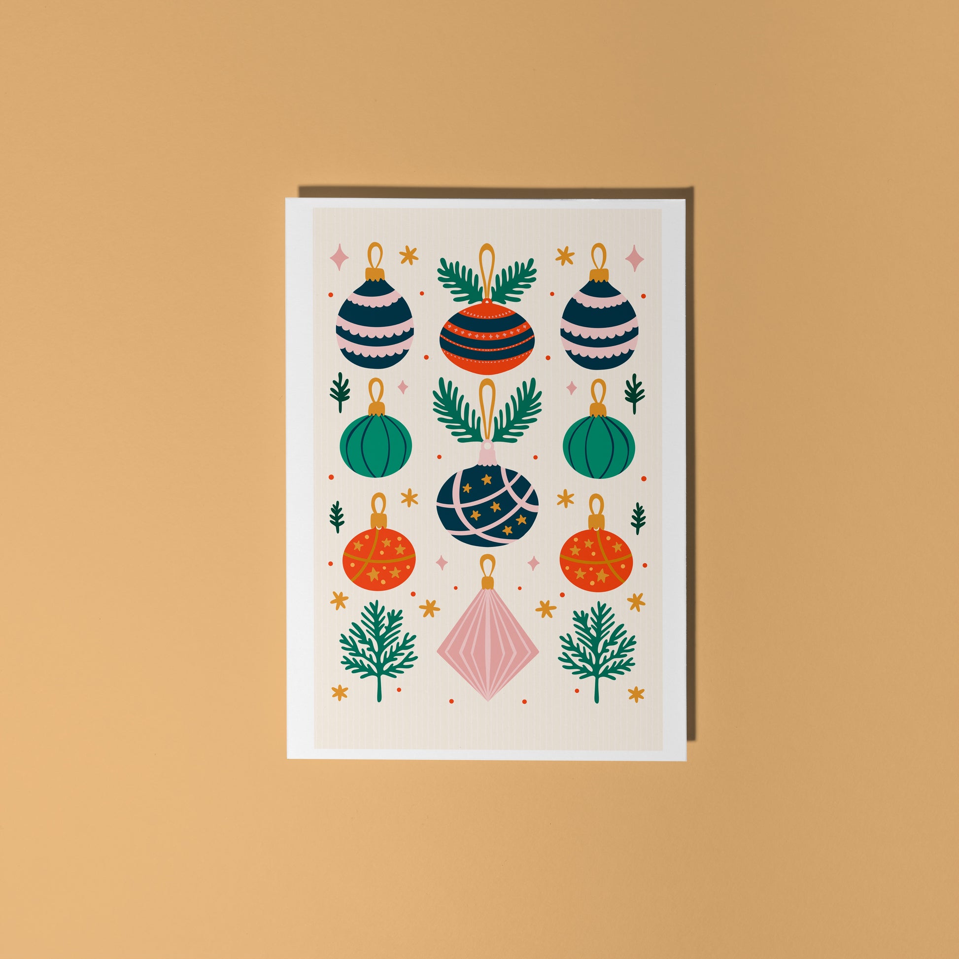 Greeting card with colorful Christmas ornament design on a beige background