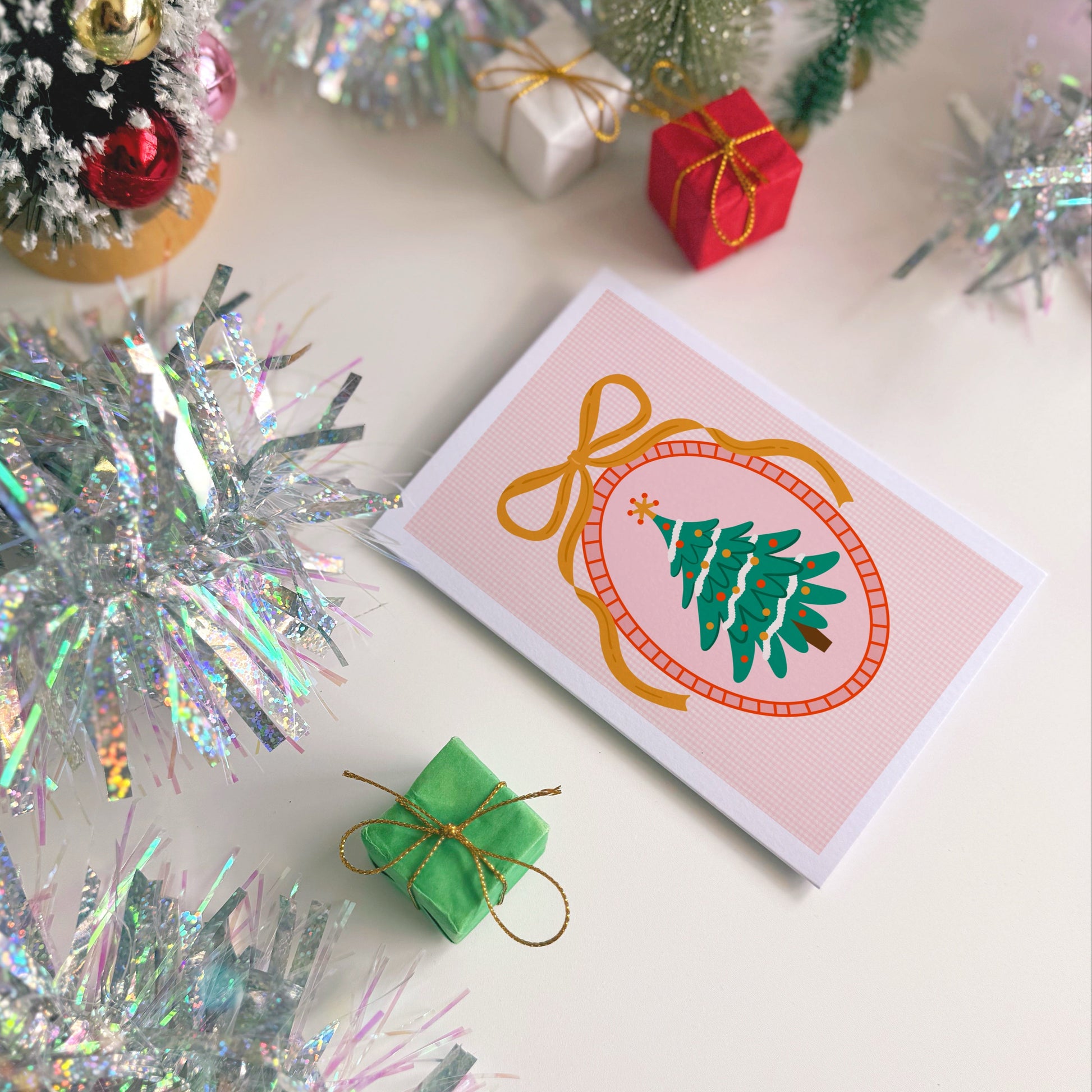 Christmas card with decorative elements on a white surface