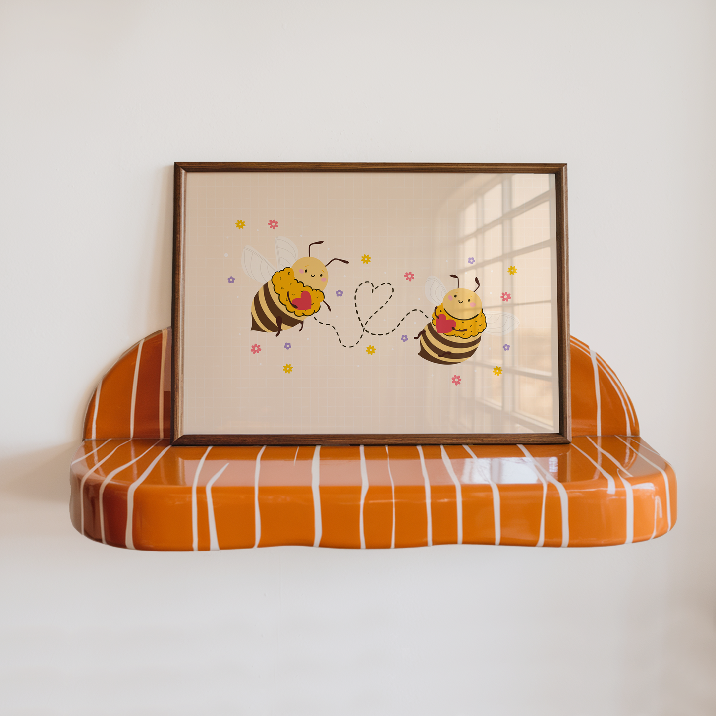 An illustrated print of two bumblebees holding red love hearts, with a dotted heart connecting the two. The bees are smiling with little pink rosy cheeks.