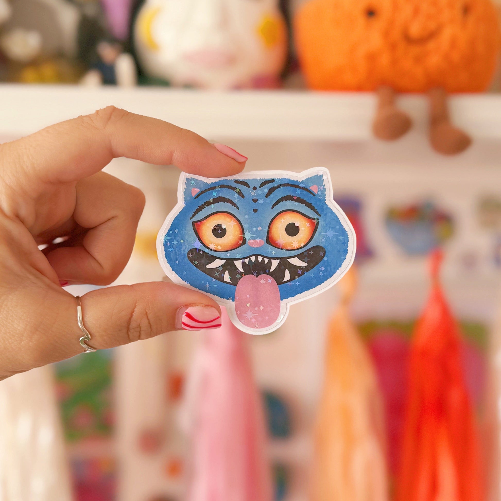 An illustrated sticker of a character from k pop demon hunters, with a holographic finish.