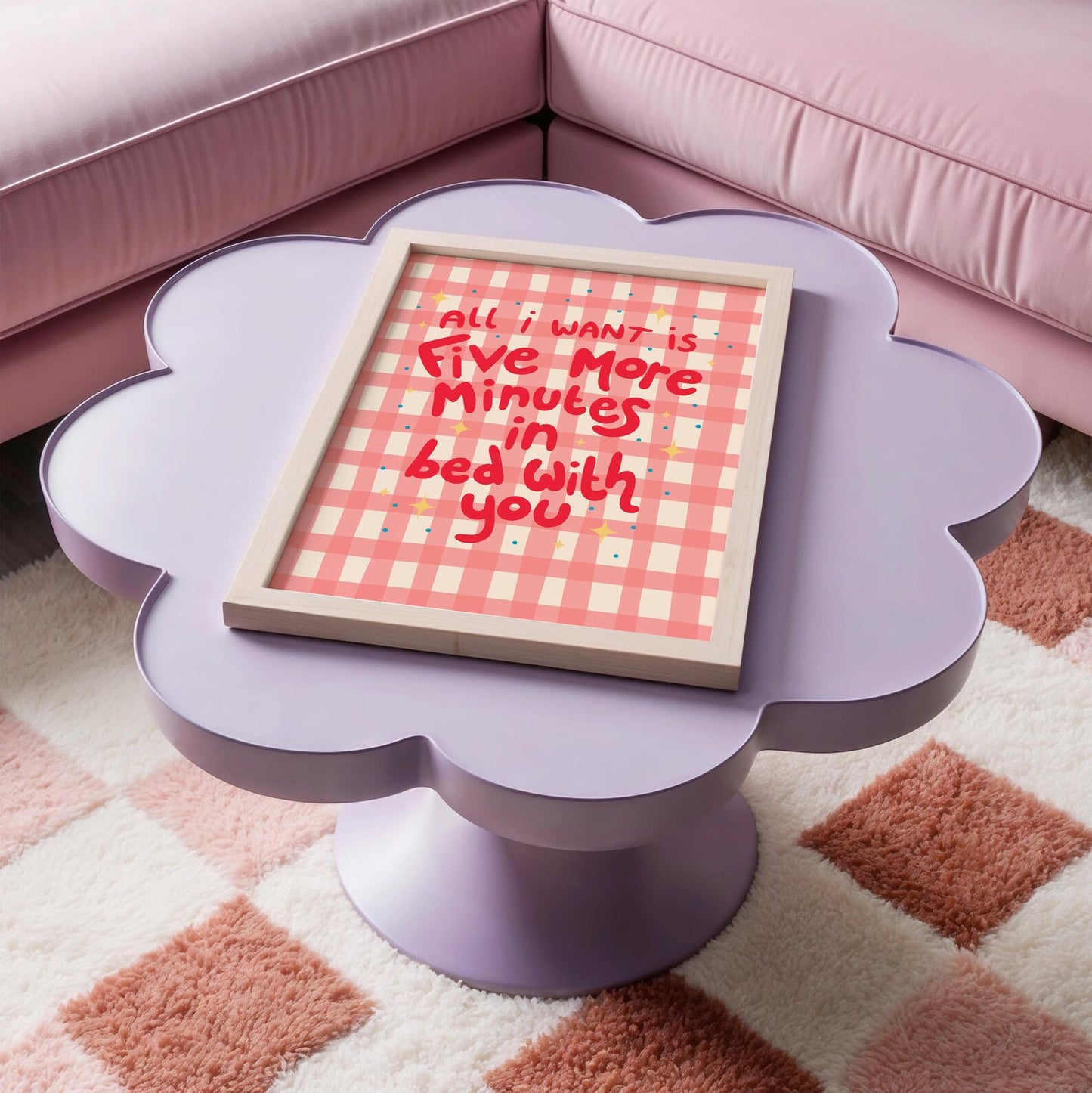 A pinky red checkered print with hand lettered text that says 'all I want is five more minutes in bed with you'.