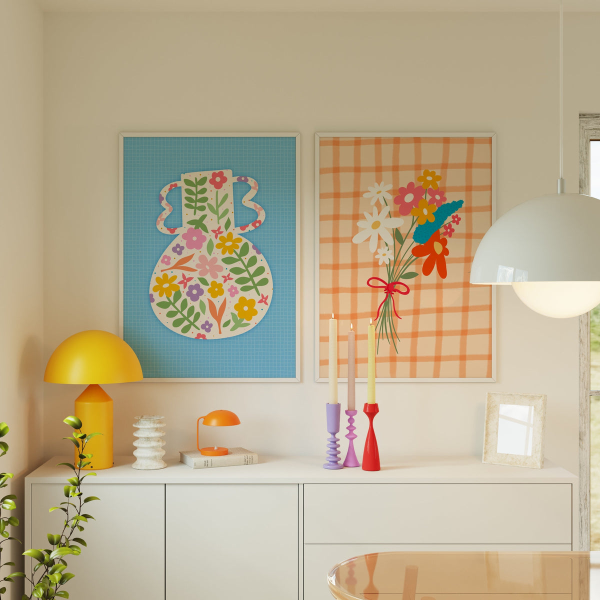 A blue art print featuring a vibrant vase illustration with floral patterns against a blue textured background. Shown next to an orange textured print with a bouquet of flowers.