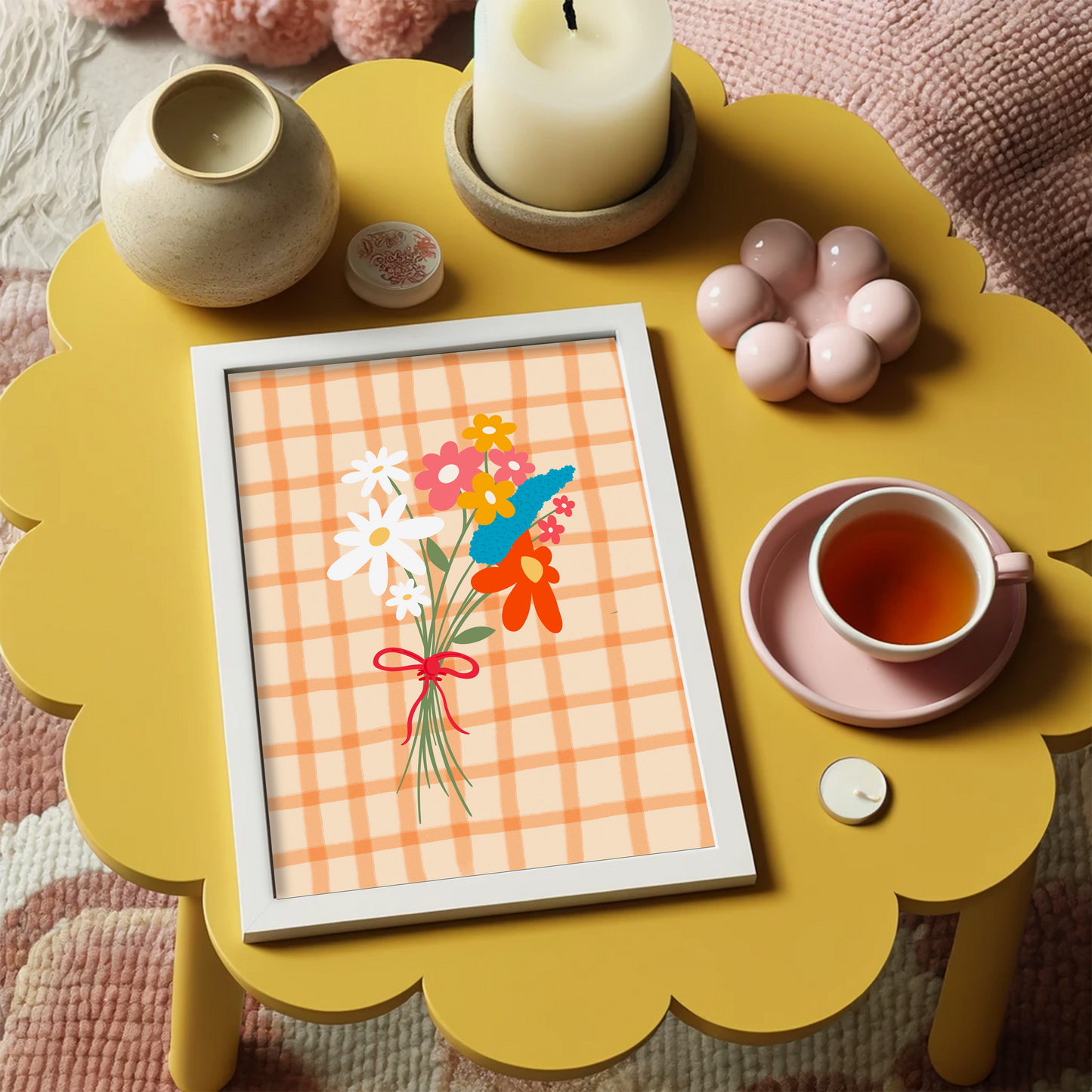 A framed art print featuring a hand-drawn bouquet of spring flowers in shades of white, pink, red, mustard, and teal on a cream and orange checkered background.