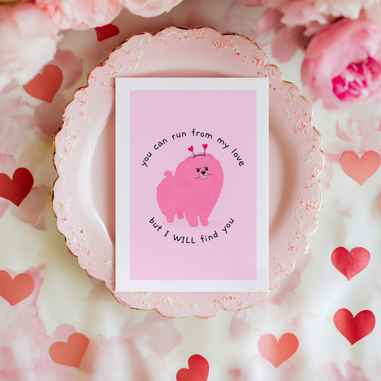 A pink card, with a picture of a fluffy dog frowning, and the words 'you can run form my love but I will find you' around the dog.