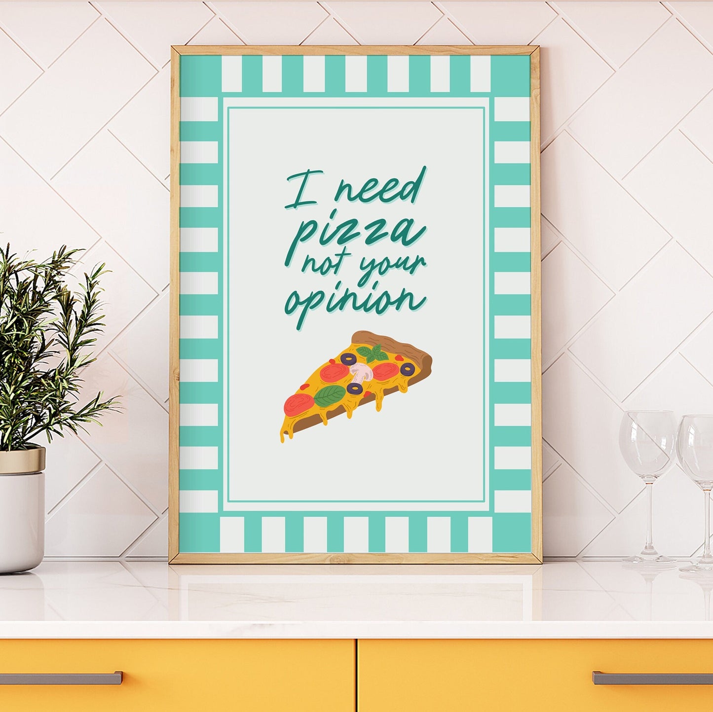 A print with the words, I need pizza not your opinion, written above an illustration of a slice of pizza. The print has a teal striped border.