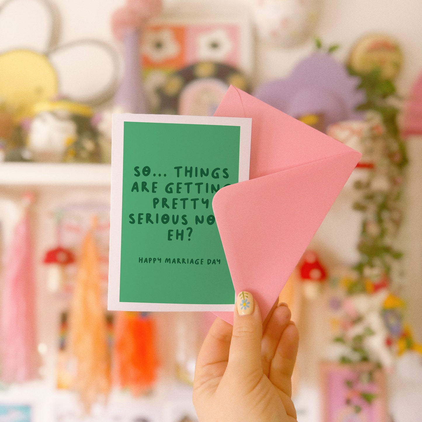 A green card, for a wedding day celebration. It says 'so... things are getting pretty serious now, eh? happy marriage day.'