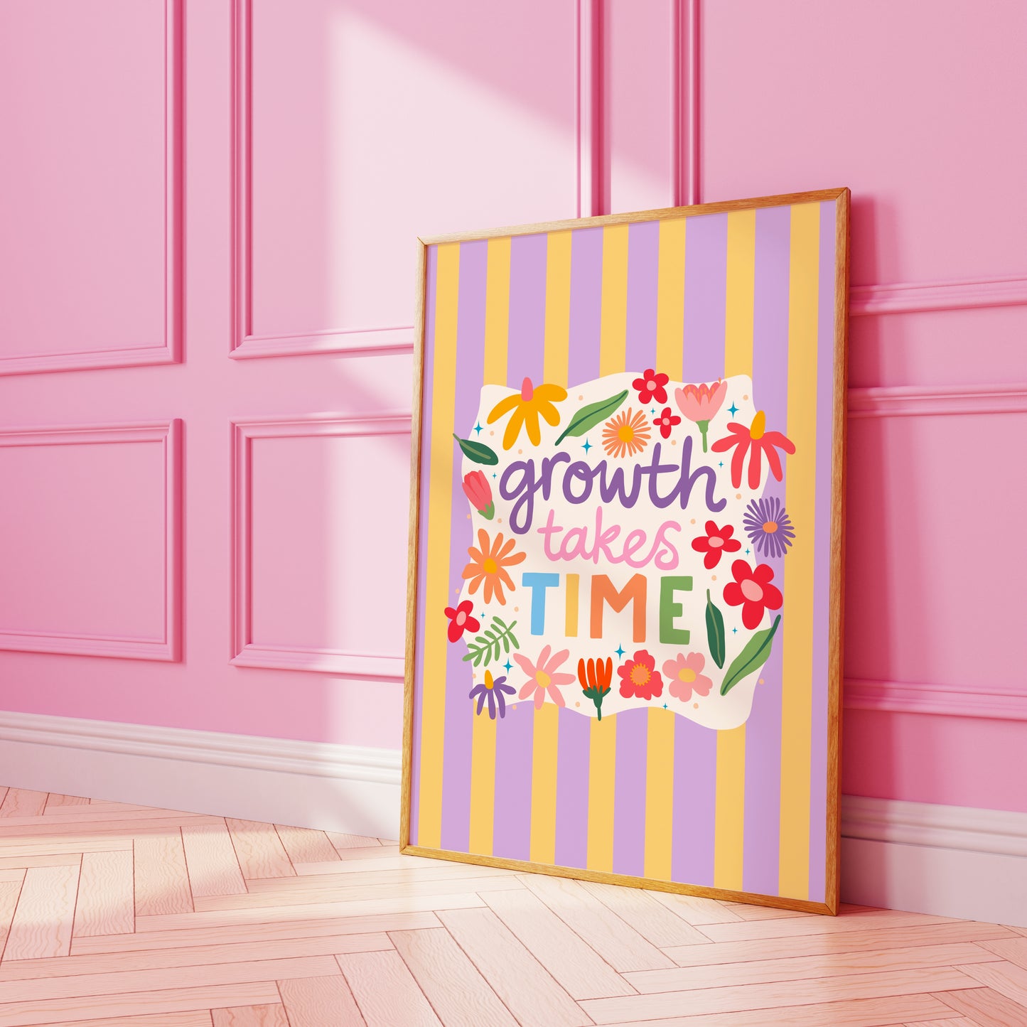 A lilac and yellow striped print, with a white wavy square in the centre that has floral illustrations and a positivity quote in the centre - that reads 'growth takes time'.