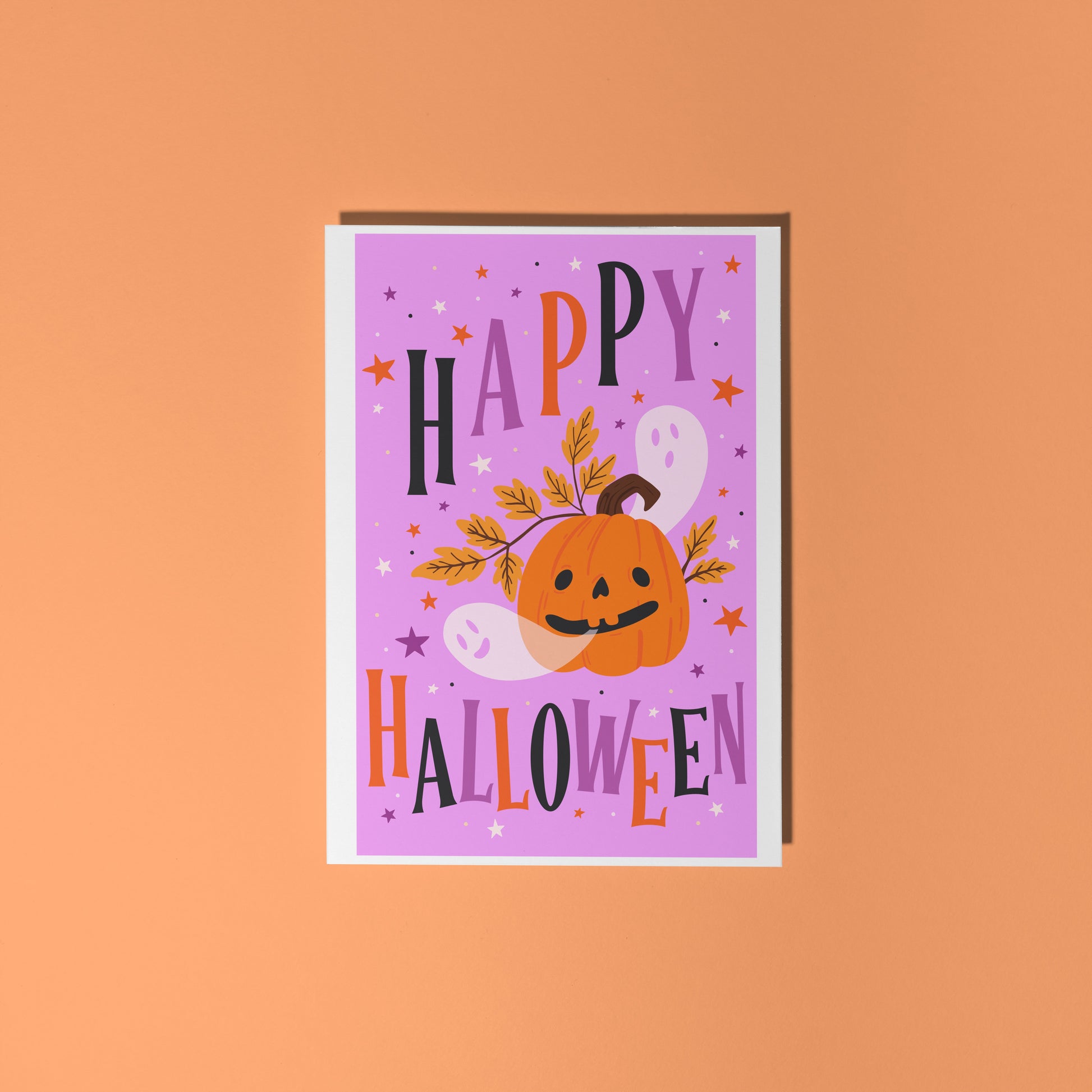 Halloween-themed card with a purple background, orange pumpkin, and colorful text on an orange background.