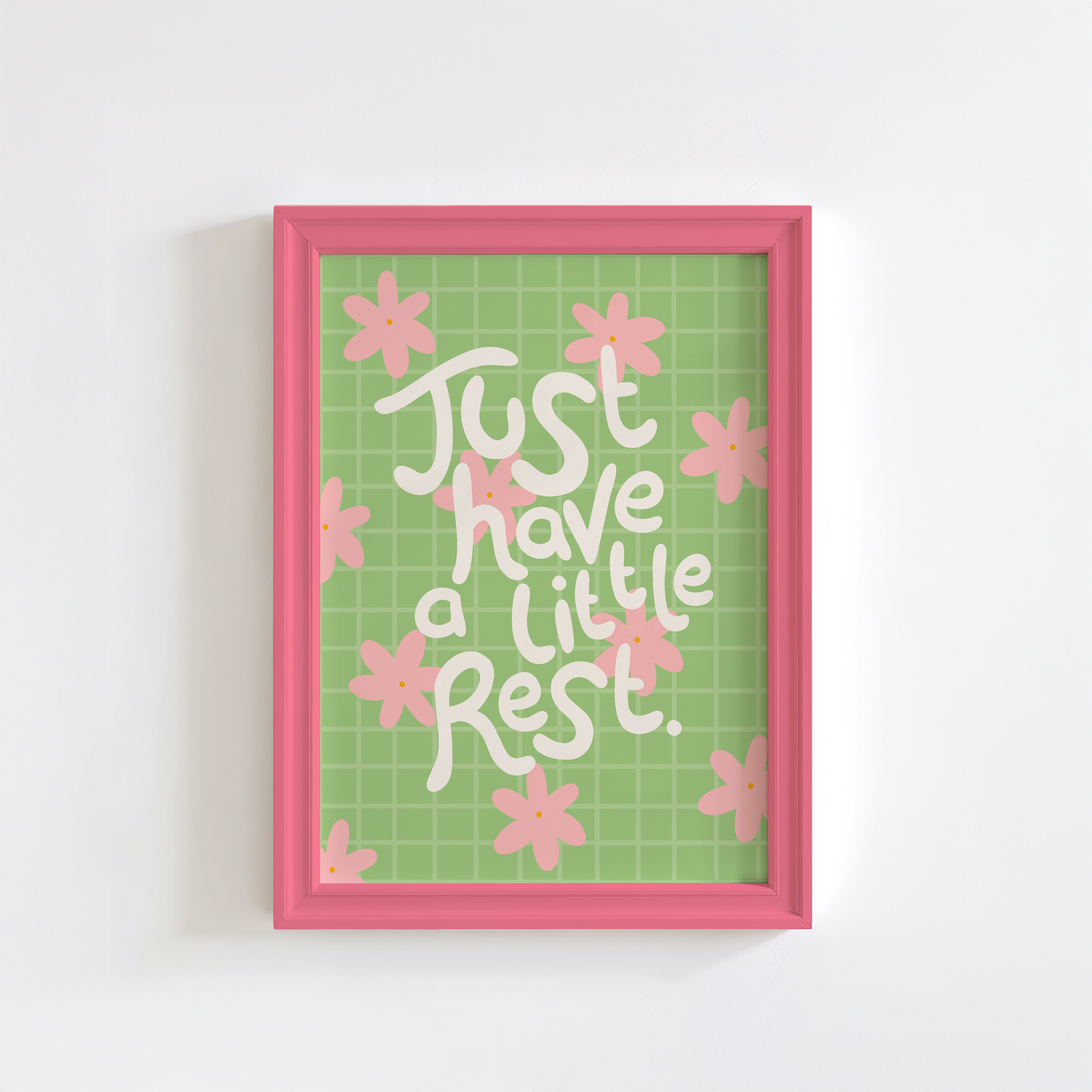 Framed artwork with 'Just have a little rest' text and pink flowers on a green grid background.