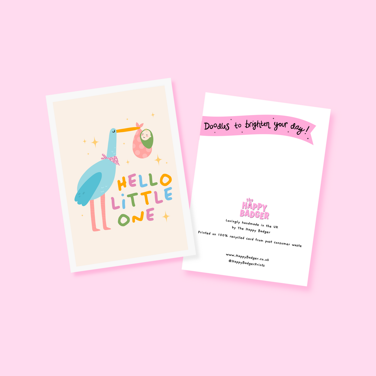A greetings card with an illustration of a stalk carrying a baby, with the words 'hello little one' in colourful tones.