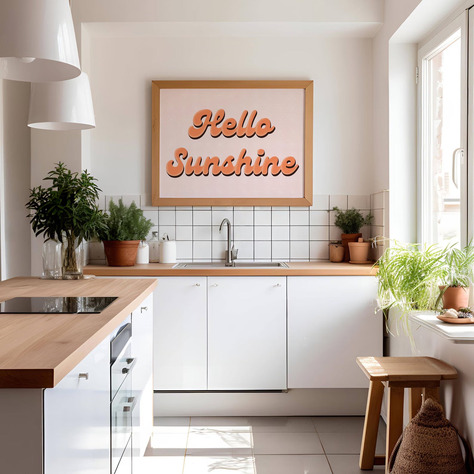 A cute quote print, with orange text saying 'Hello Sunshine' on a pale pink background.
