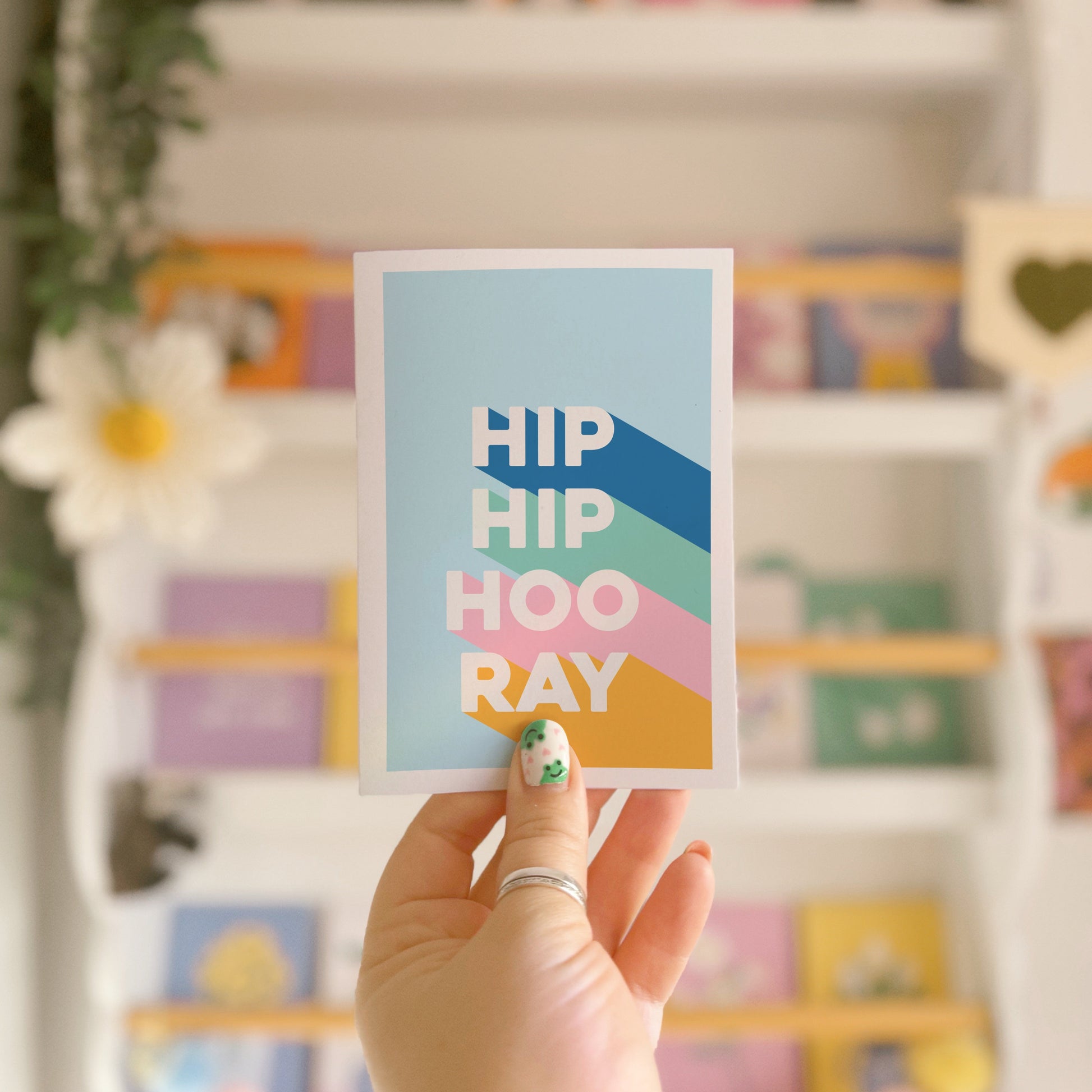 A congratulations card, saying Hip Hip Hooray in blue, green, pink and yellow.