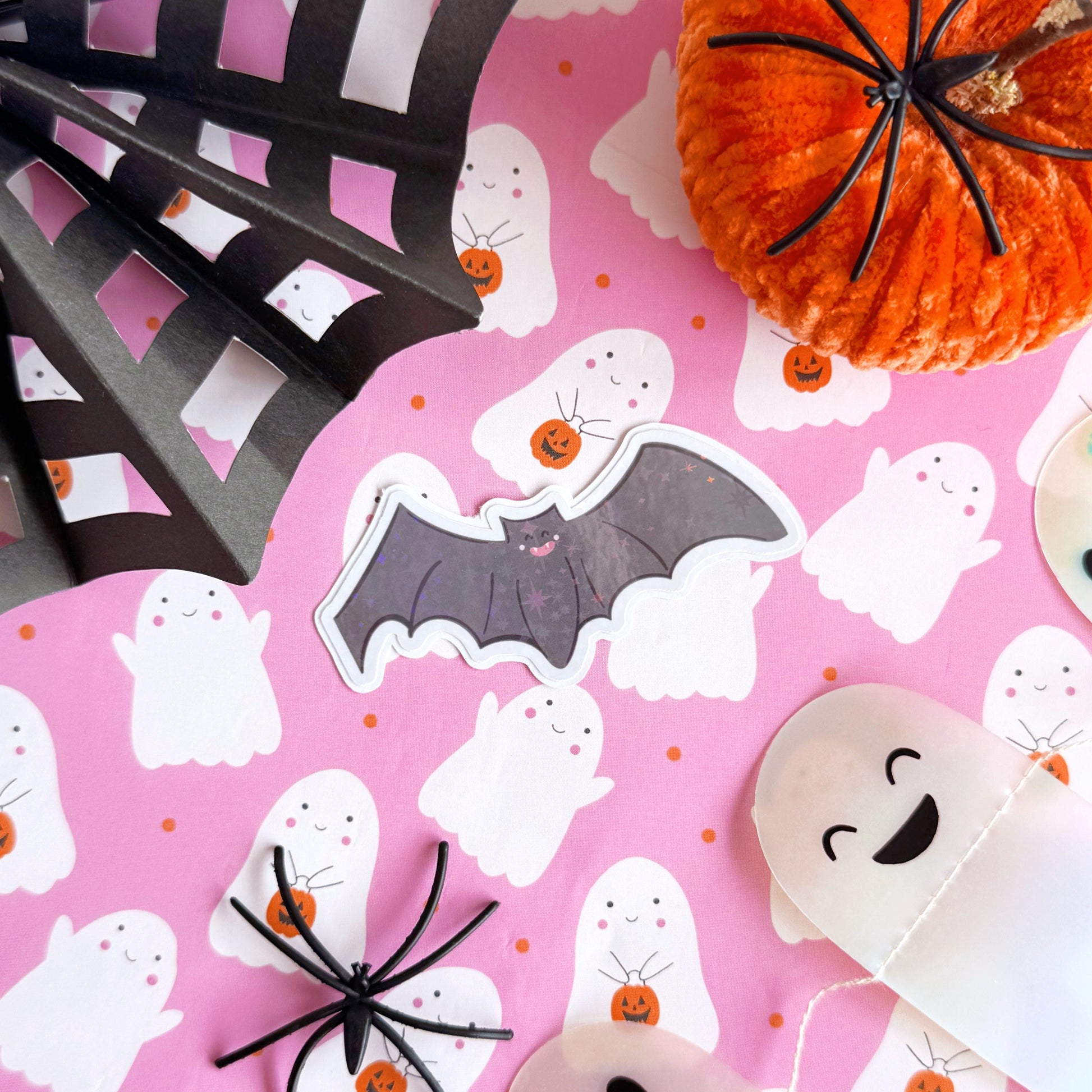 An image of a bat sticker, with a holographic finish and an easy-peel lip to detach the sticker from its backing easily.