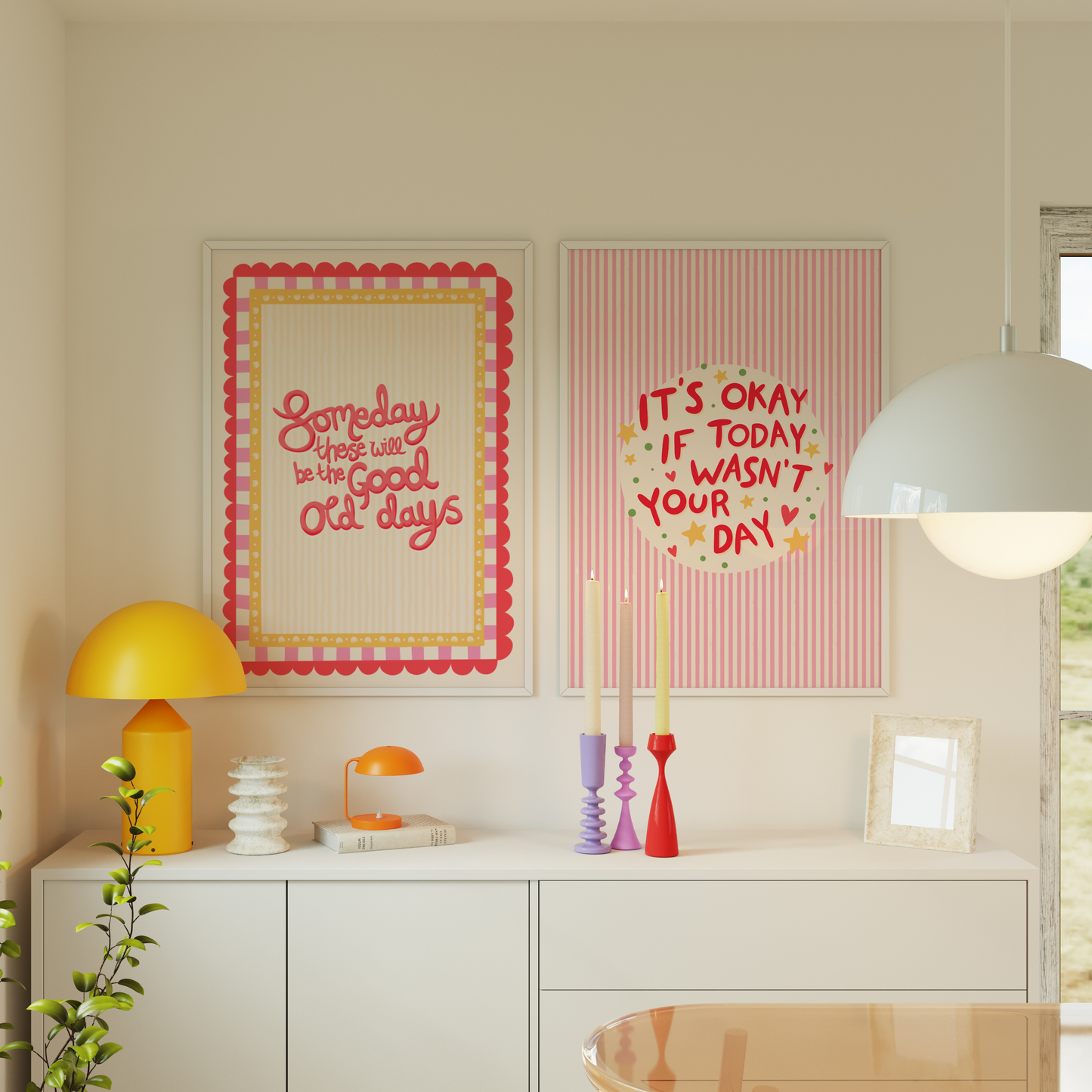 Decorative posters on a wall with motivational phrases, a yellow lamp, and a white cabinet.