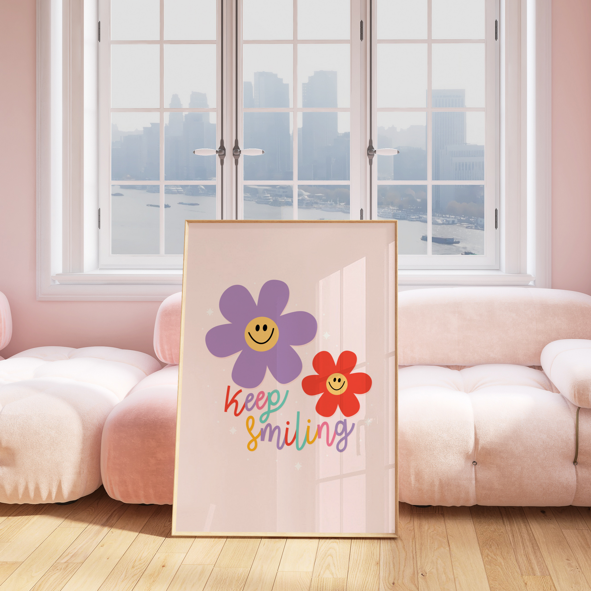 A fun quote print with text saying keep smiling, with two smiling daises in purple and red, on a soft pink background.