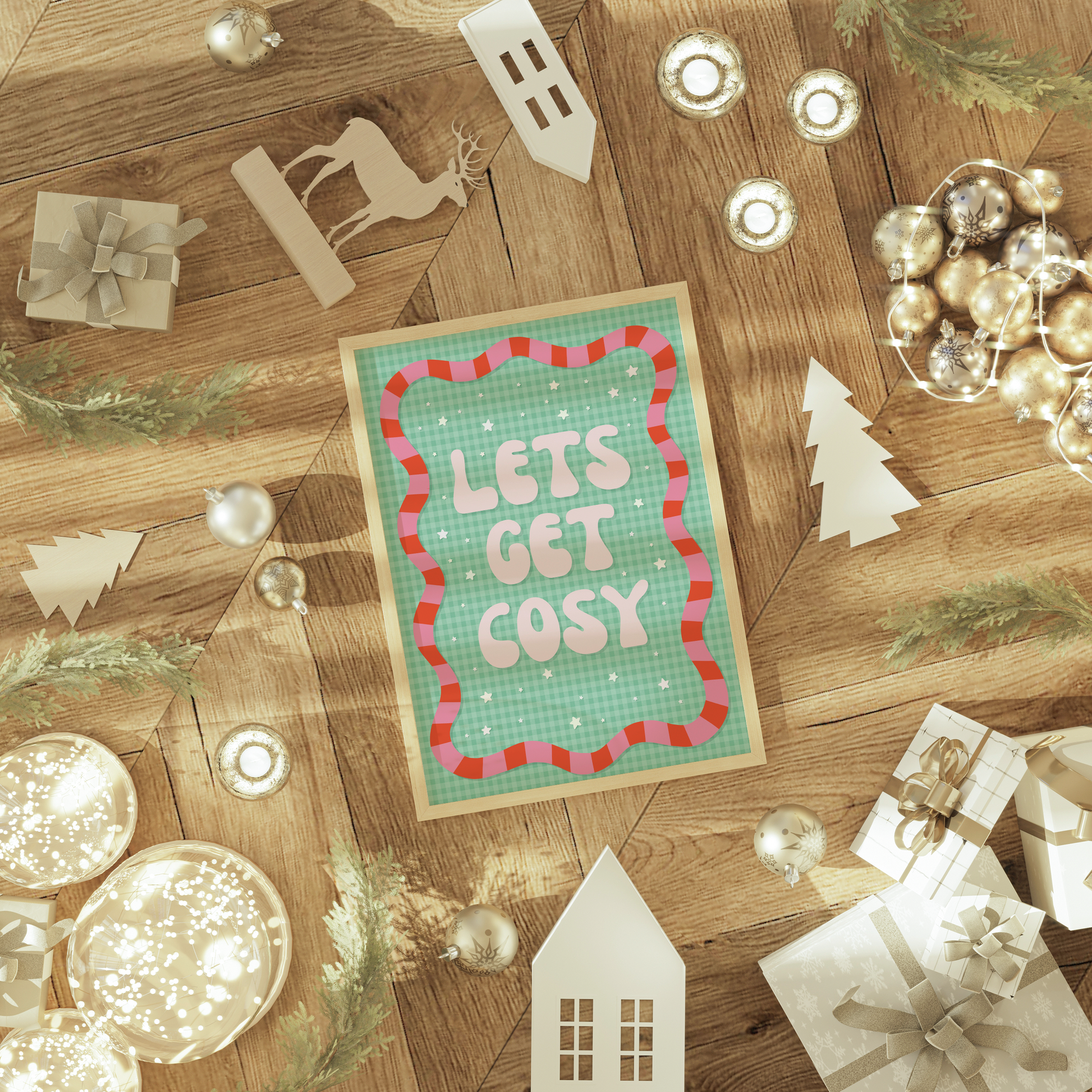 Christmas-themed decor with 'Let's Get Cosy' print on a wooden surface.