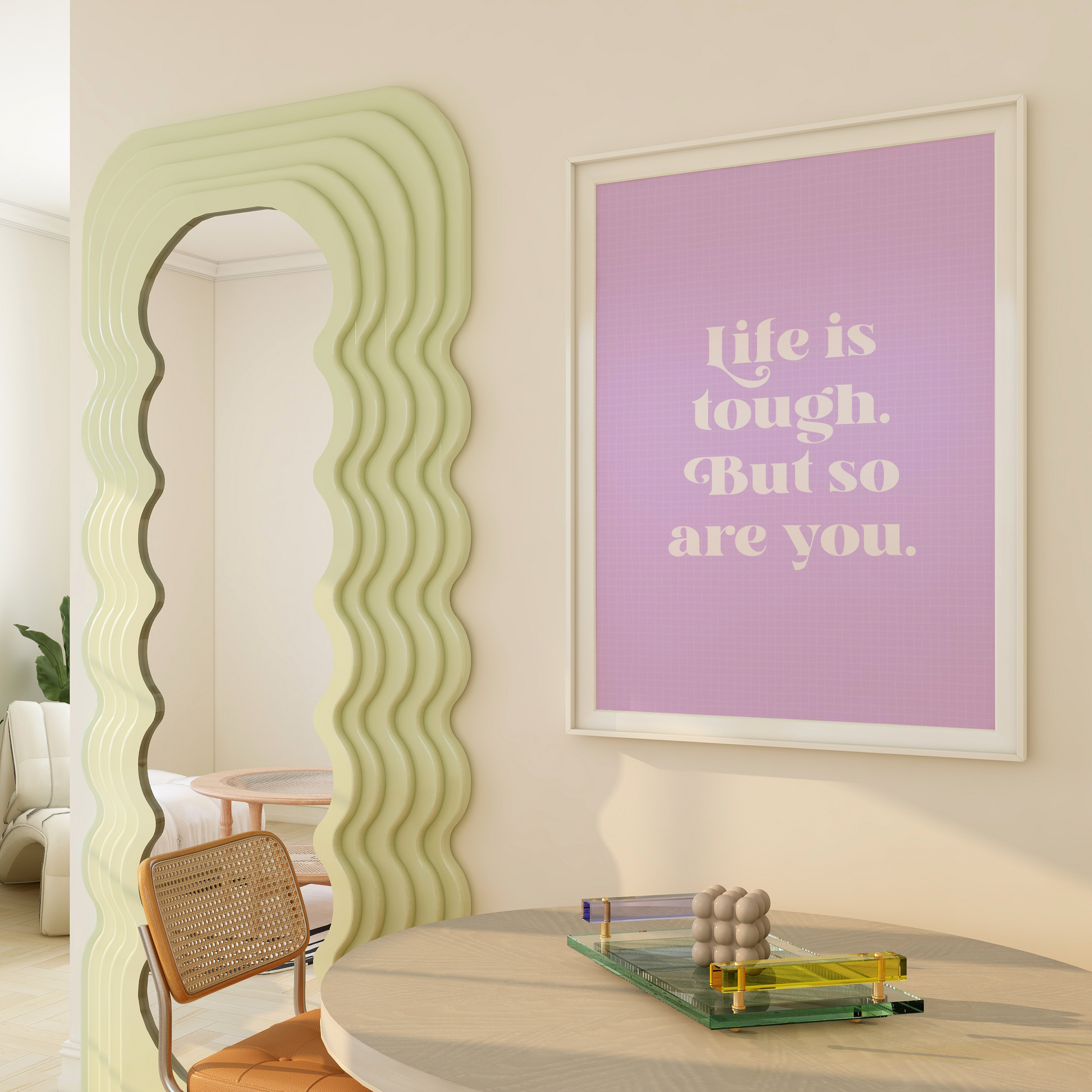 A framed print with a purple background and blue frame, containing the text 'Life is tough. But so are you.' in white font.