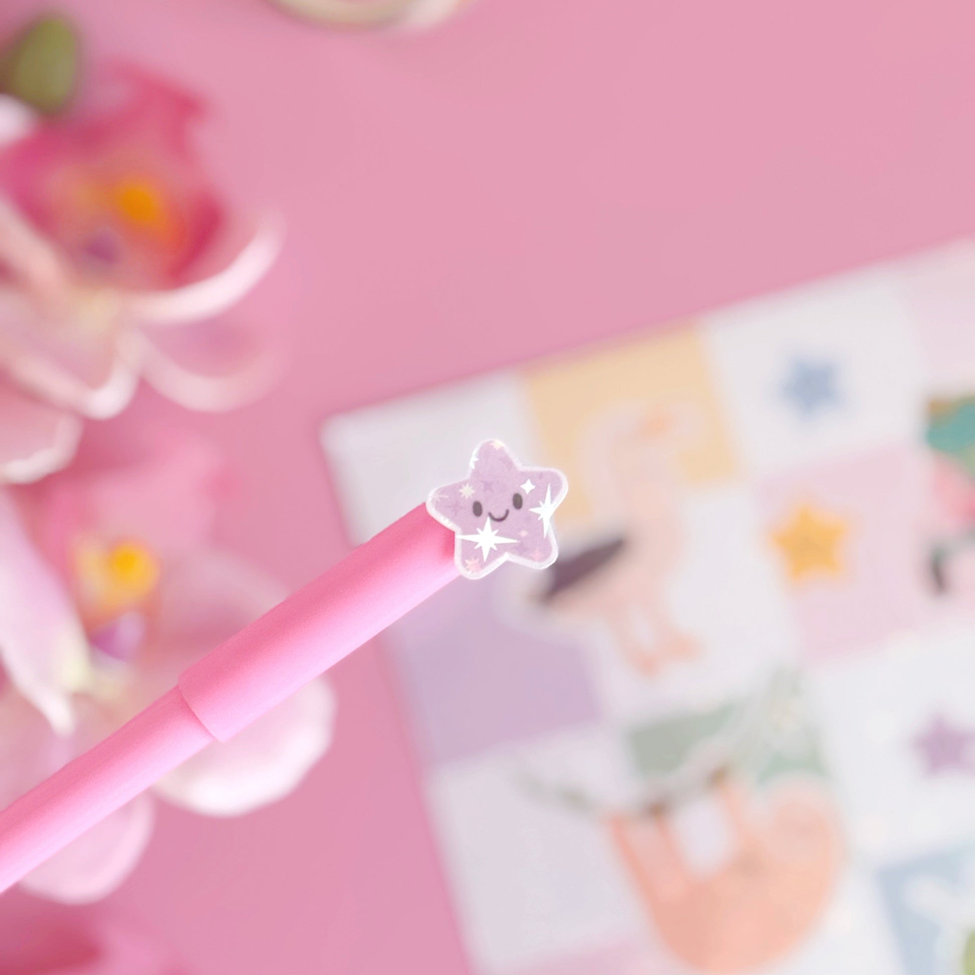 A sticker from the mini sticker pals sticker sheet. This is one of the stars in purple, coated with a holographic laminate with little starbursts on.