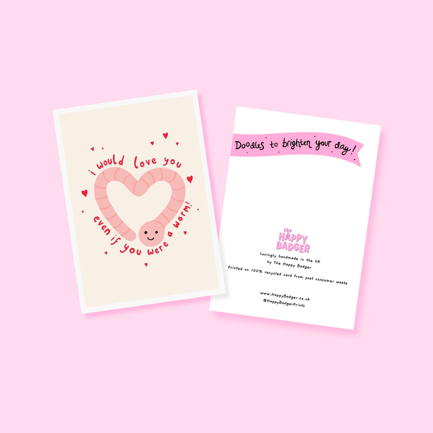 An illustrated card with a drawing of a cute smiling worm on the front, in the shape of a heart. Around the worm is text that reads 'I would love you even if you were a worm!'.