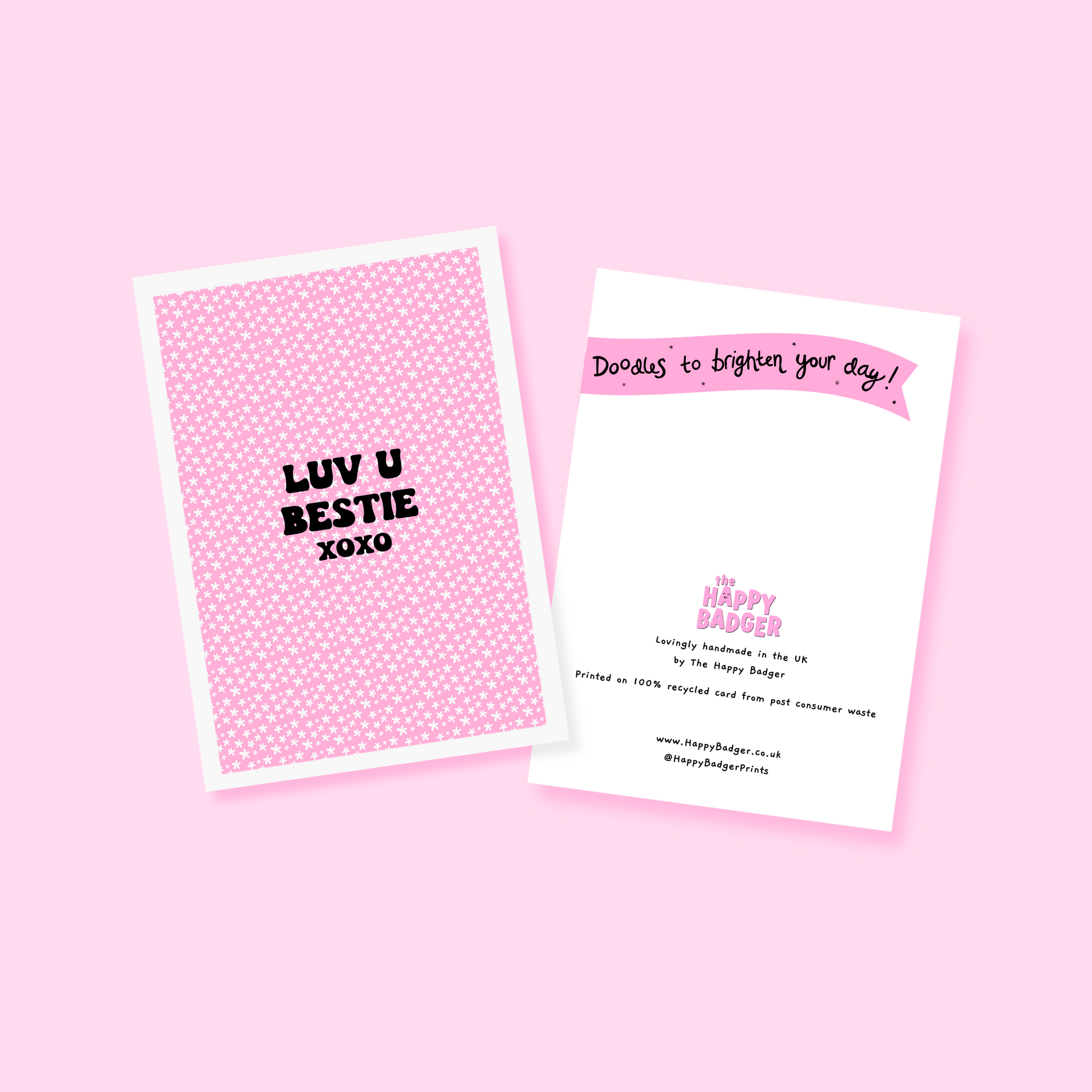 A pink greetings card, with the message 'Luv u bestie xoxo' on the front.