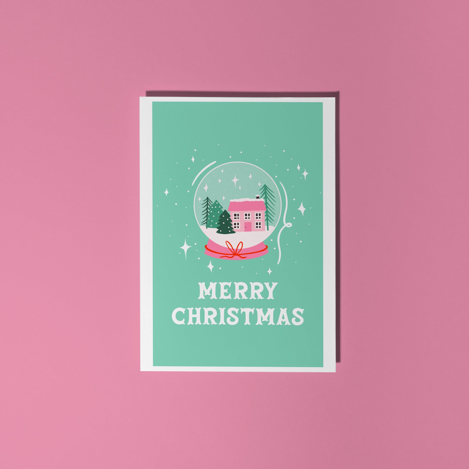 Christmas card with a snow globe design and 'Merry Christmas' text on a green background