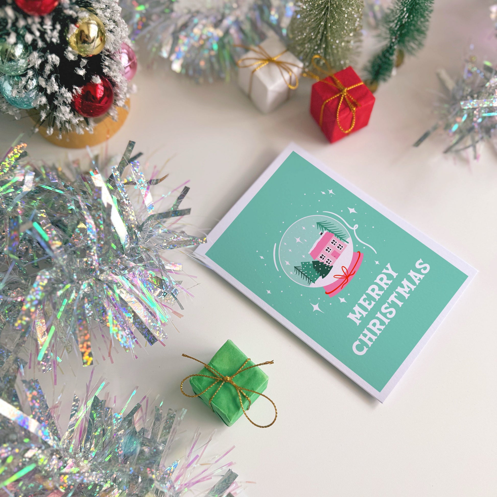 Christmas card with decorative elements on a white surface