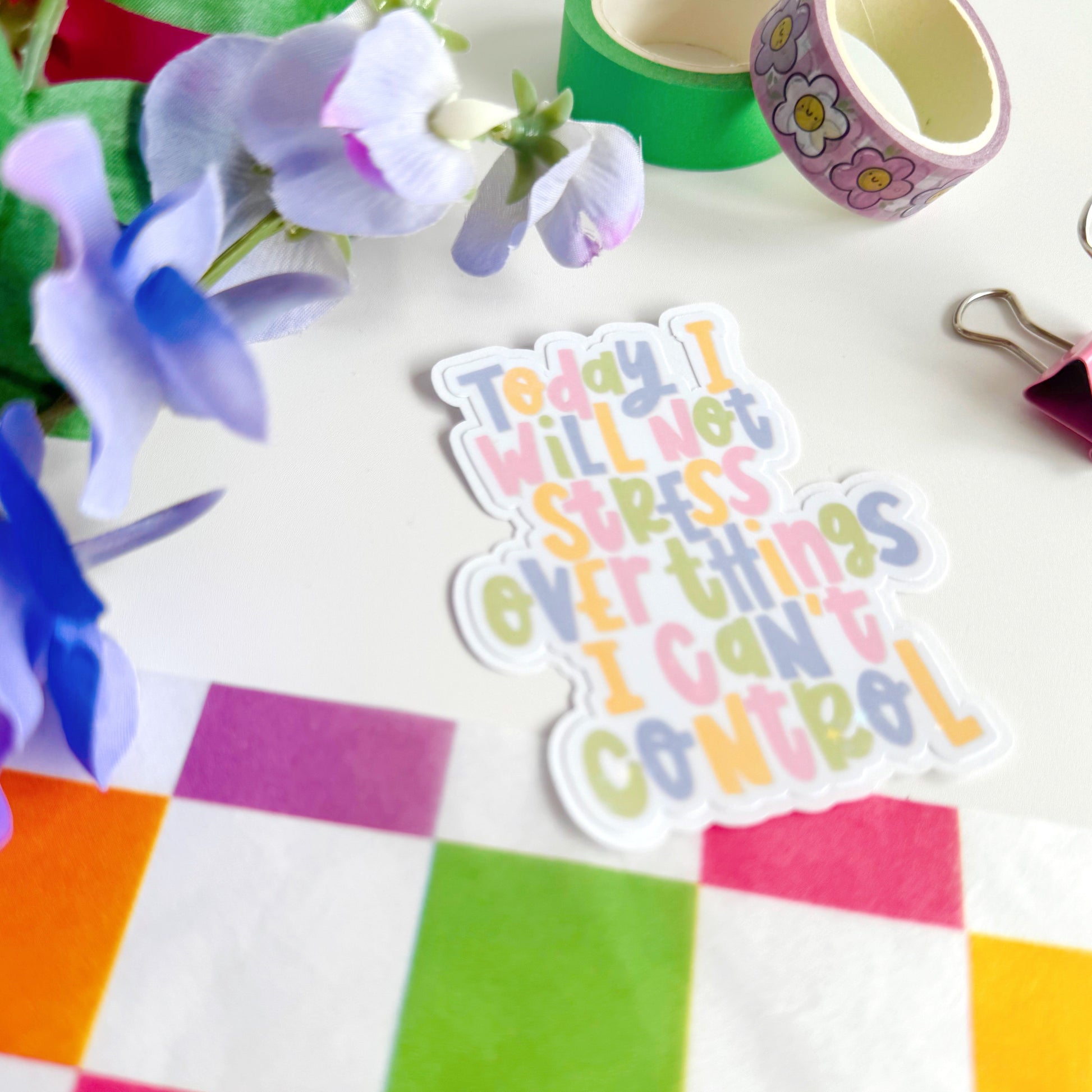 A holographic sticker, with the quote today I will not stress over things I can't control on it. The sticker has an easy peel lip.