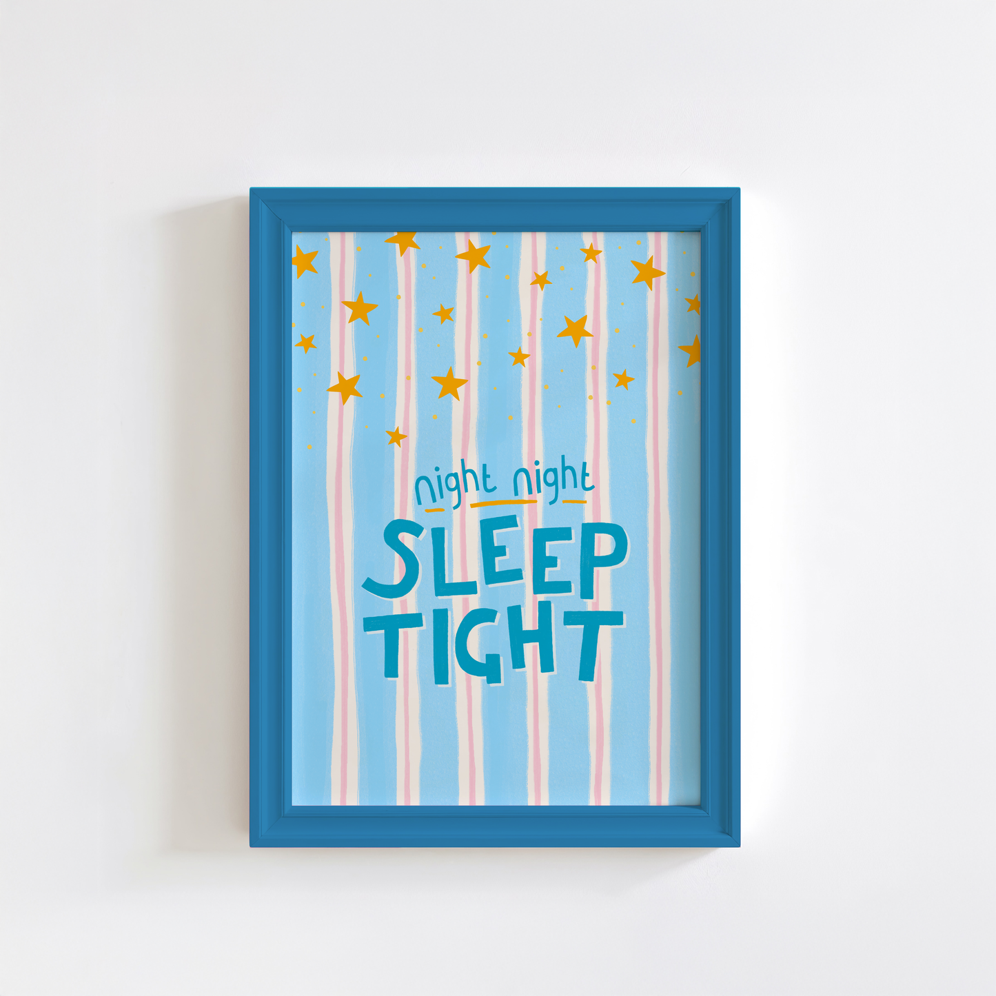 Framed artwork with 'night night sleep tight' text and star patterns on a light blue background.