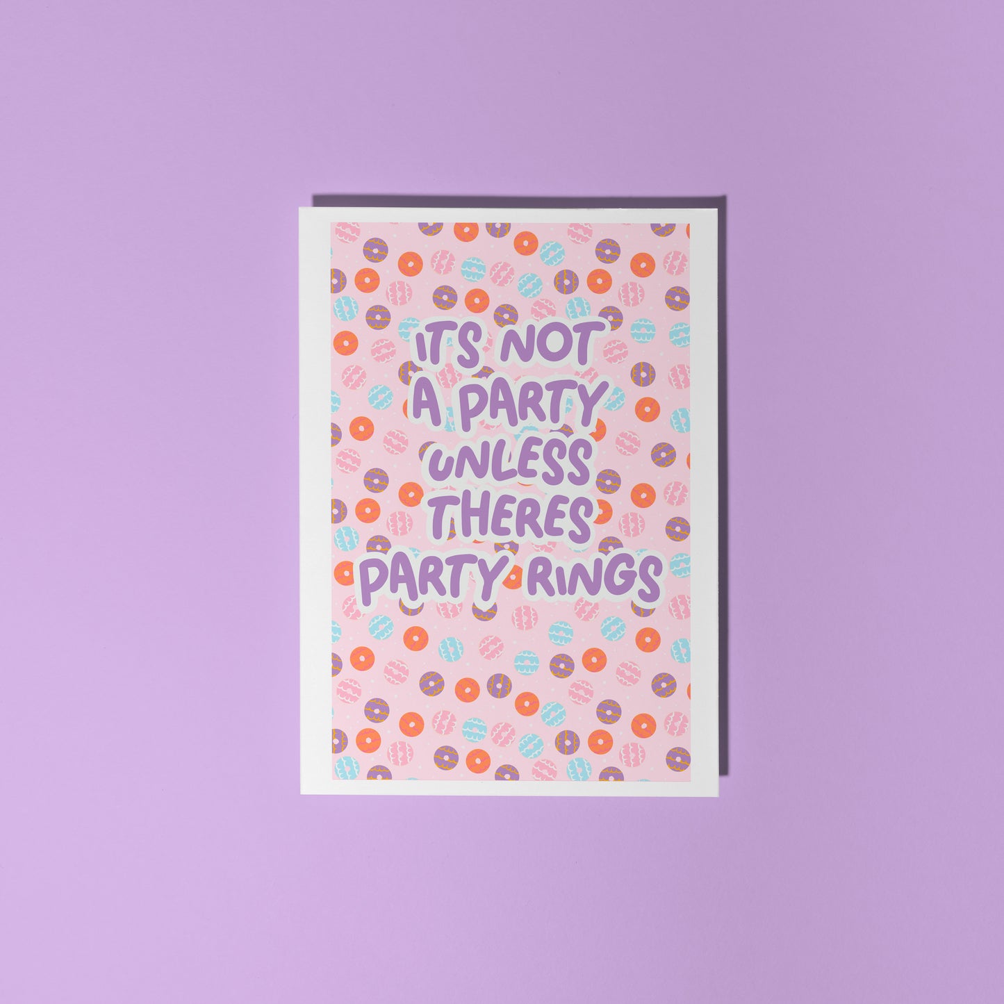 A birthday card, with a party ring pattern, and the text says 'it's not a party unless there's party rings'