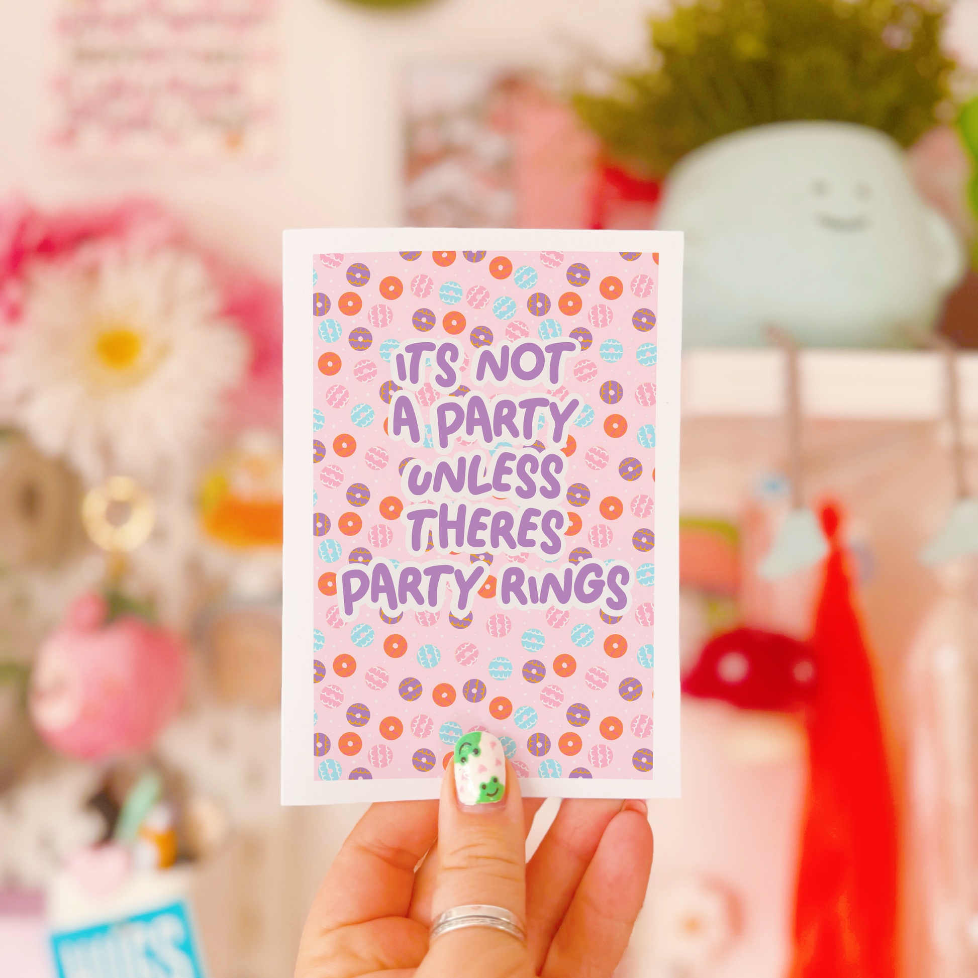 A birthday card, with a party ring pattern, and the text says 'it's not a party unless there's party rings'