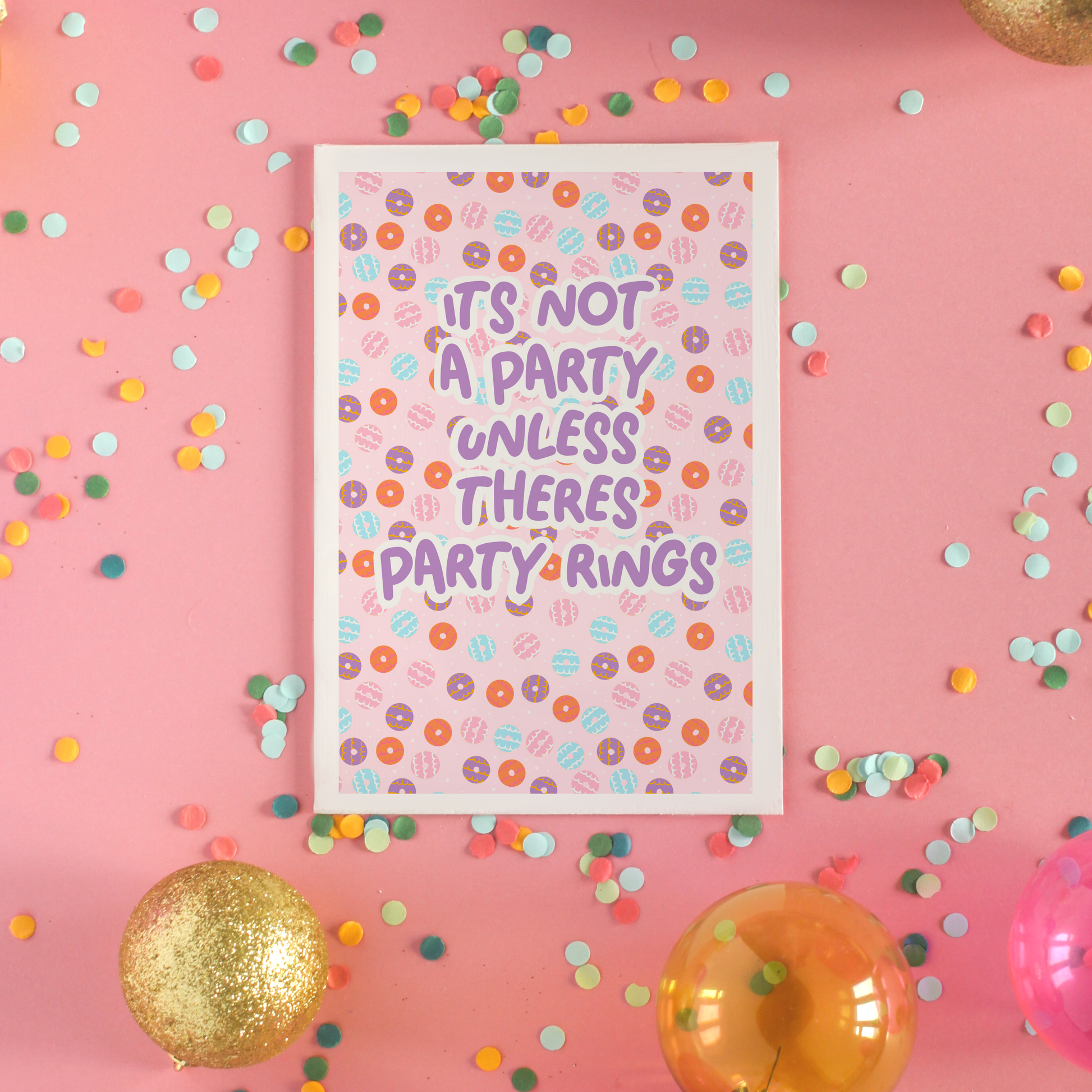 A birthday card, with a party ring pattern, and the text says 'it's not a party unless there's party rings'
