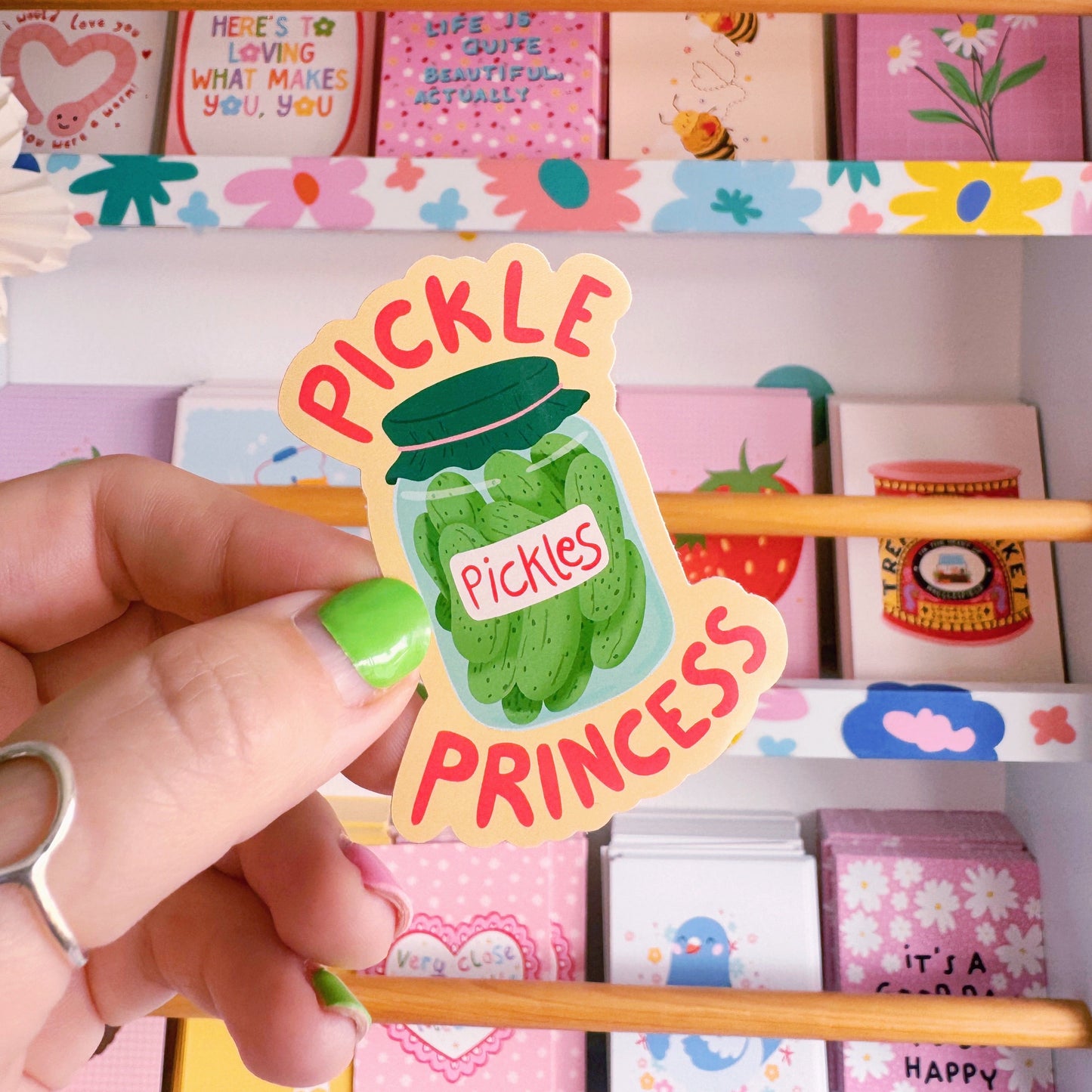 A waterproof vinyl sticker featuring a jar of pickles and the words 'pickle princess' around the jar illustration.