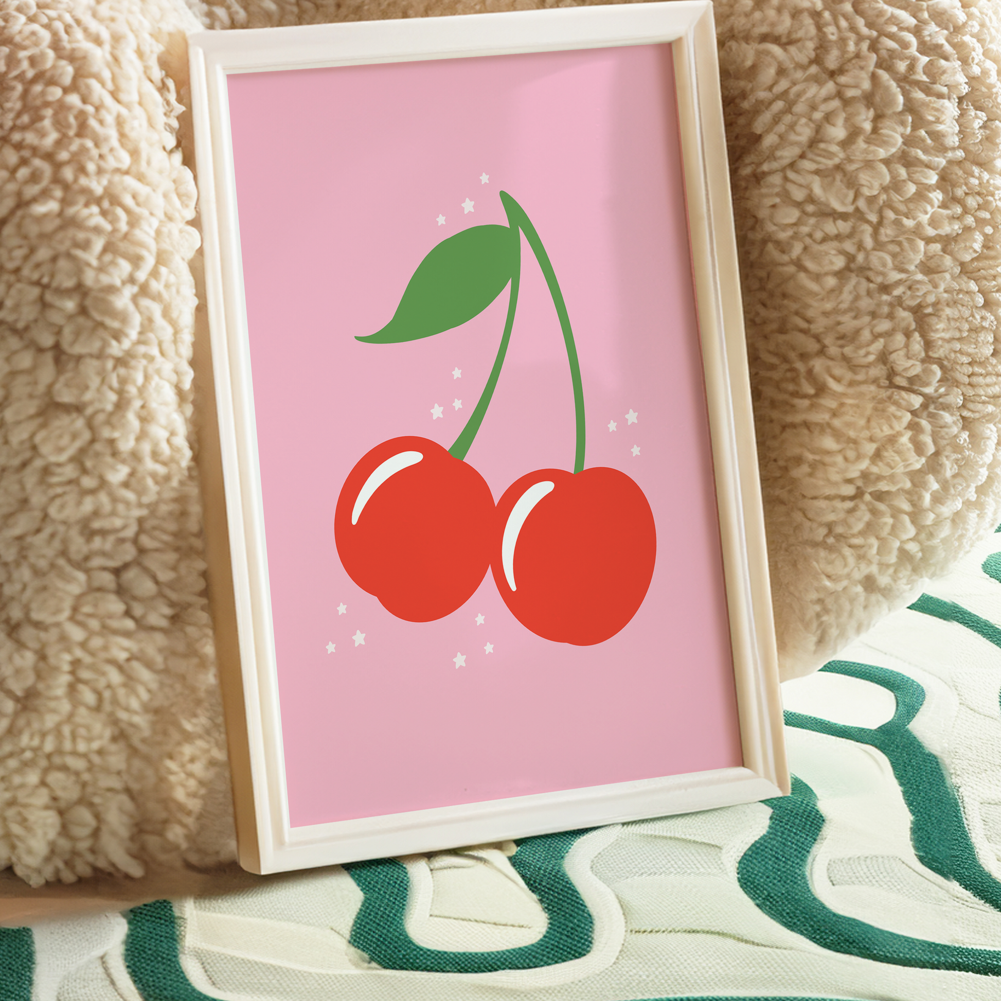 A bright pink print showing a cute illustration of red cherries.