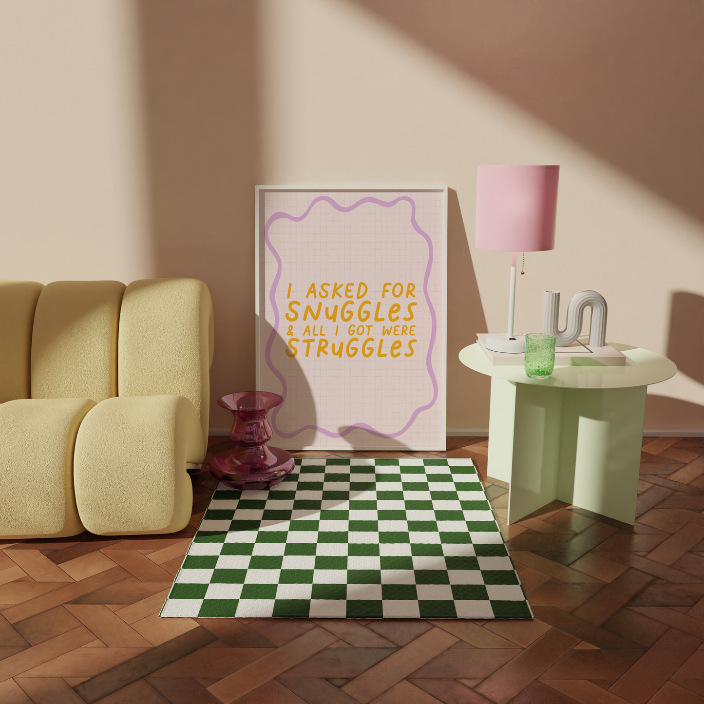 A cute quote print, saying I asked for snuggles, and all I got were struggles on a pale pink background with a purple squiggly border.