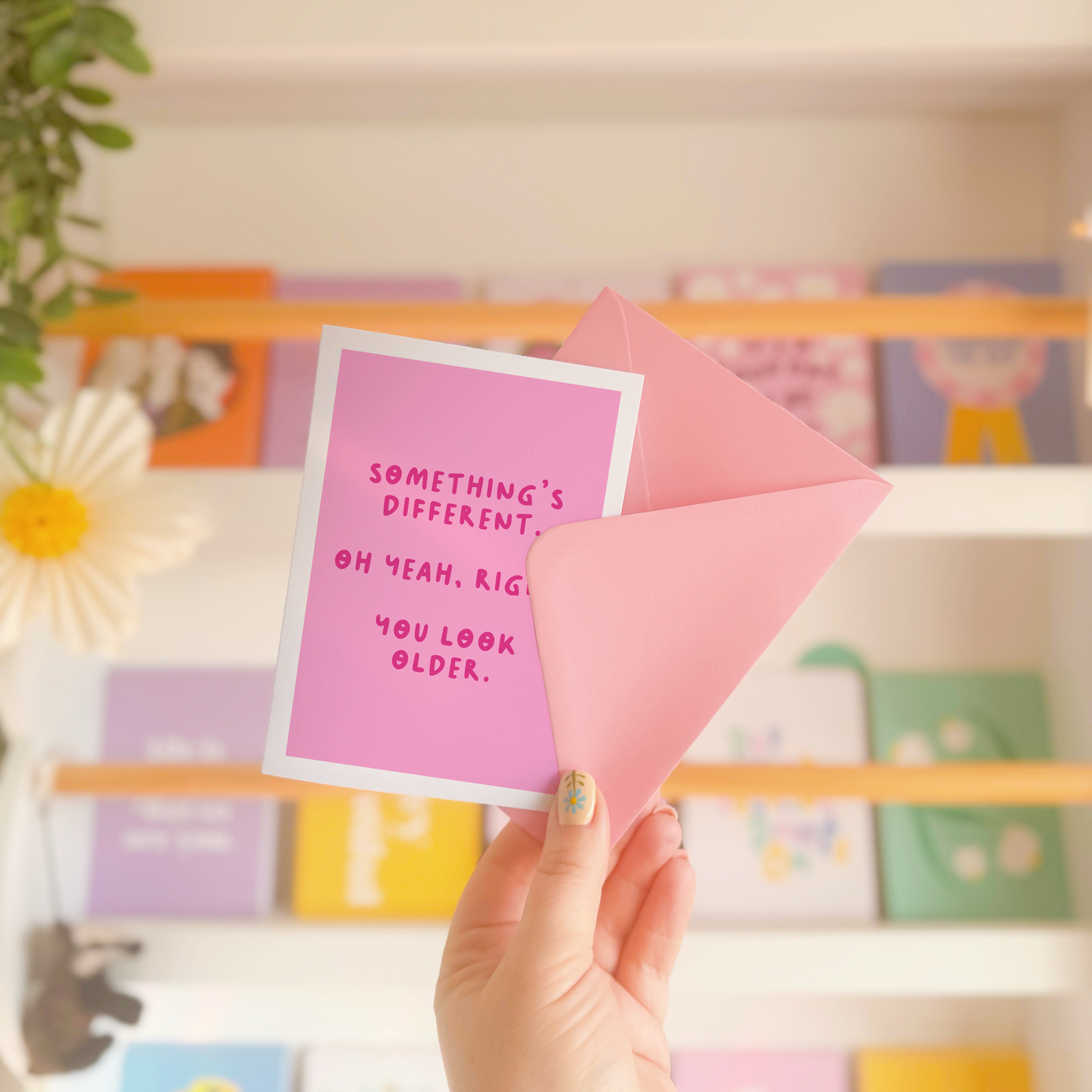 A simple birthday card, with a funny sarcastic message on the front which reads 'Something's different. Oh yeah, right. You look older.'
