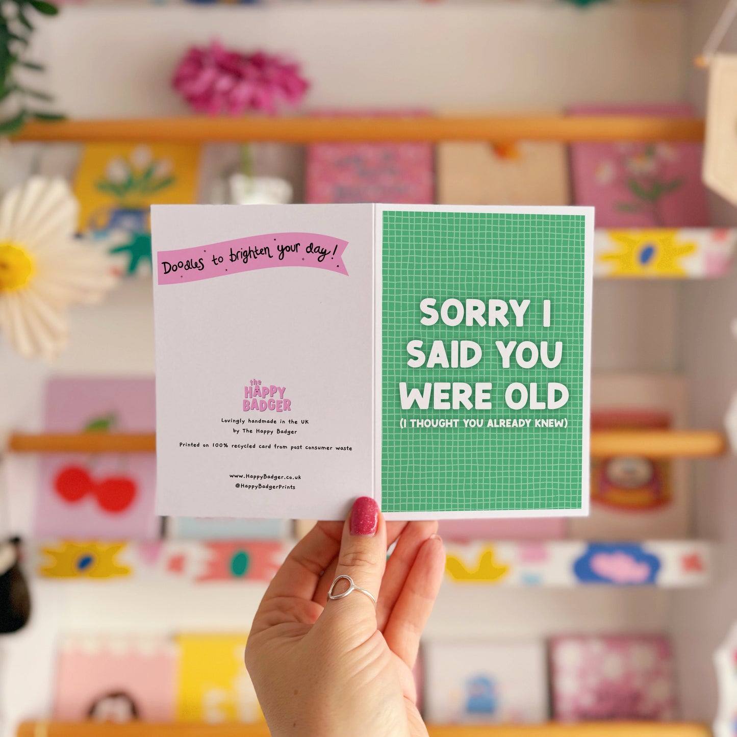 A green birthday card, with a humorous saying on the front - "Sorry I Said You Were Old (I thought you already knew)"