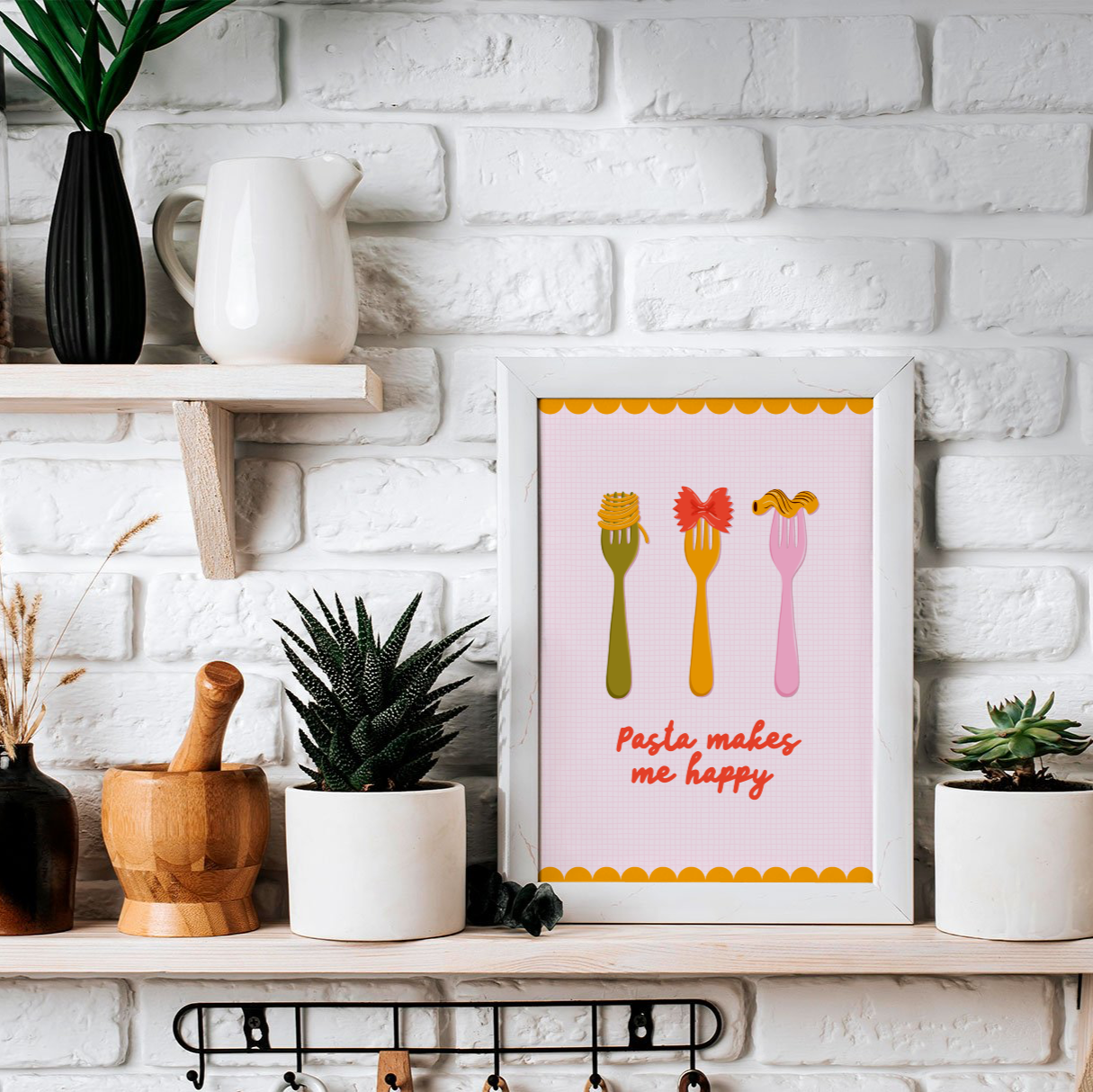 A pasta themed print, with a yellow scalloped border. There are three forks with different types of pasta on them in the centre, along with the words 'pasta makes me happy'.