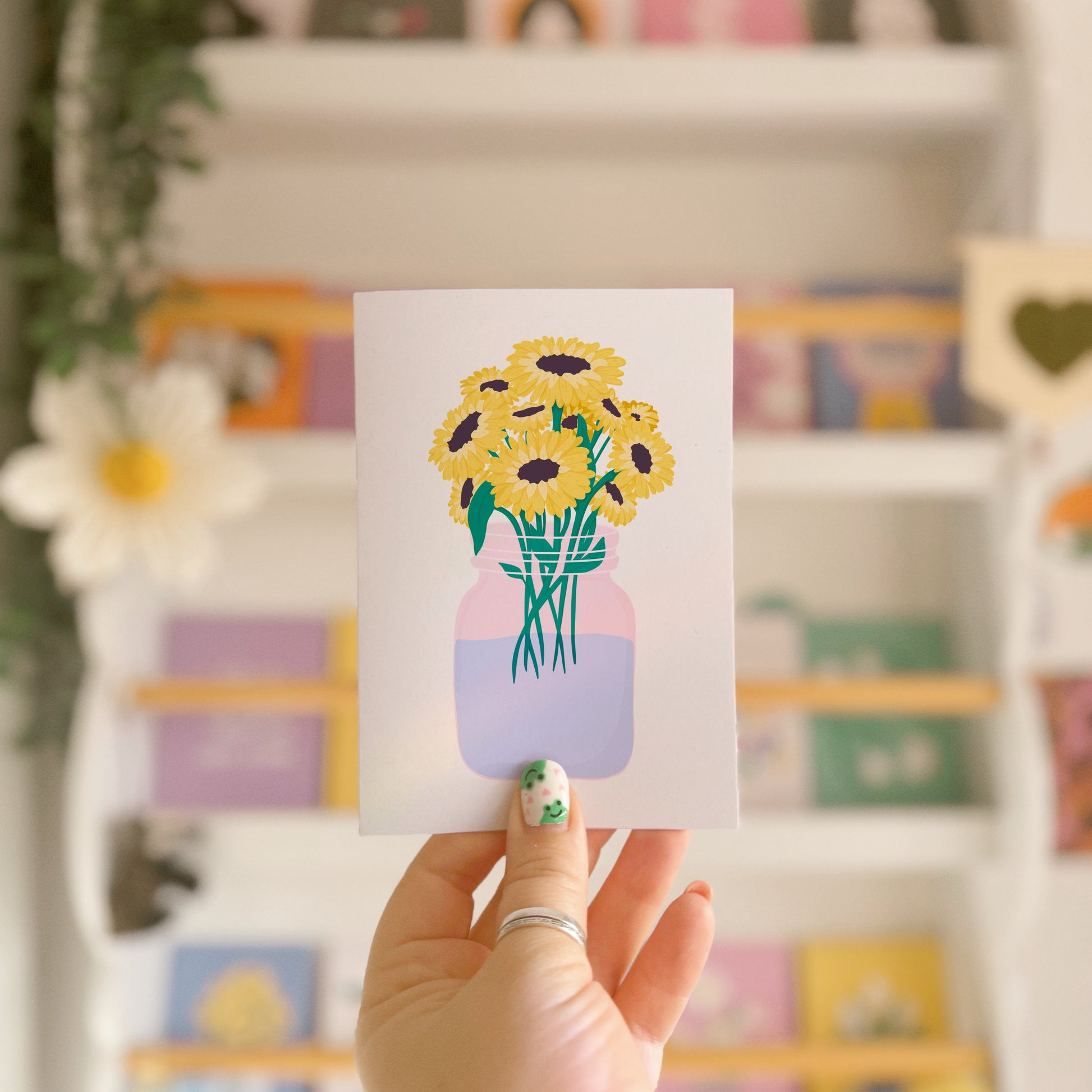 A greetings card with a bouquet of flowers, the card is otherwise blank to convey any sentiment.