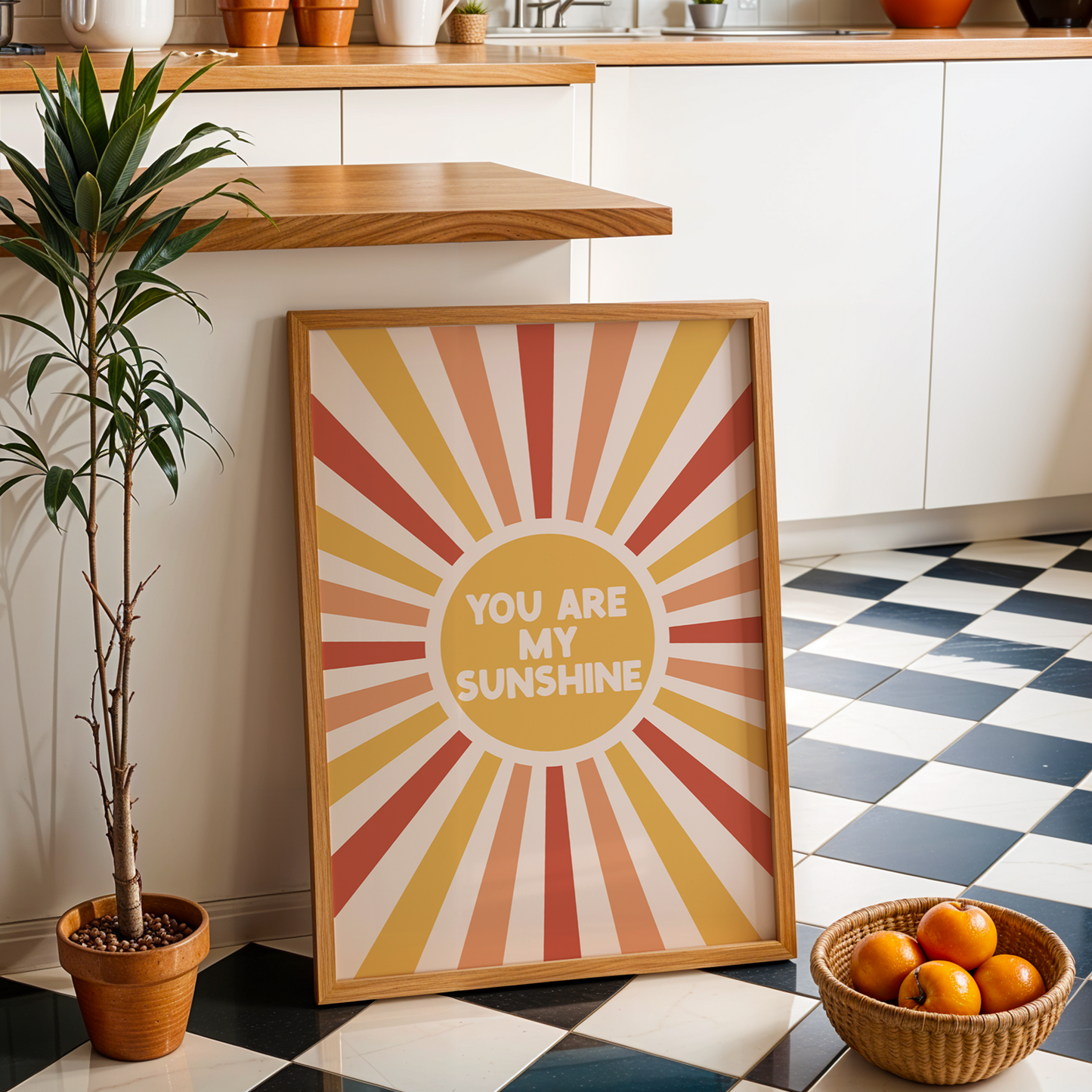 Colorful sunburst frame with 'You are my sunshine' text in a kitchen setting.