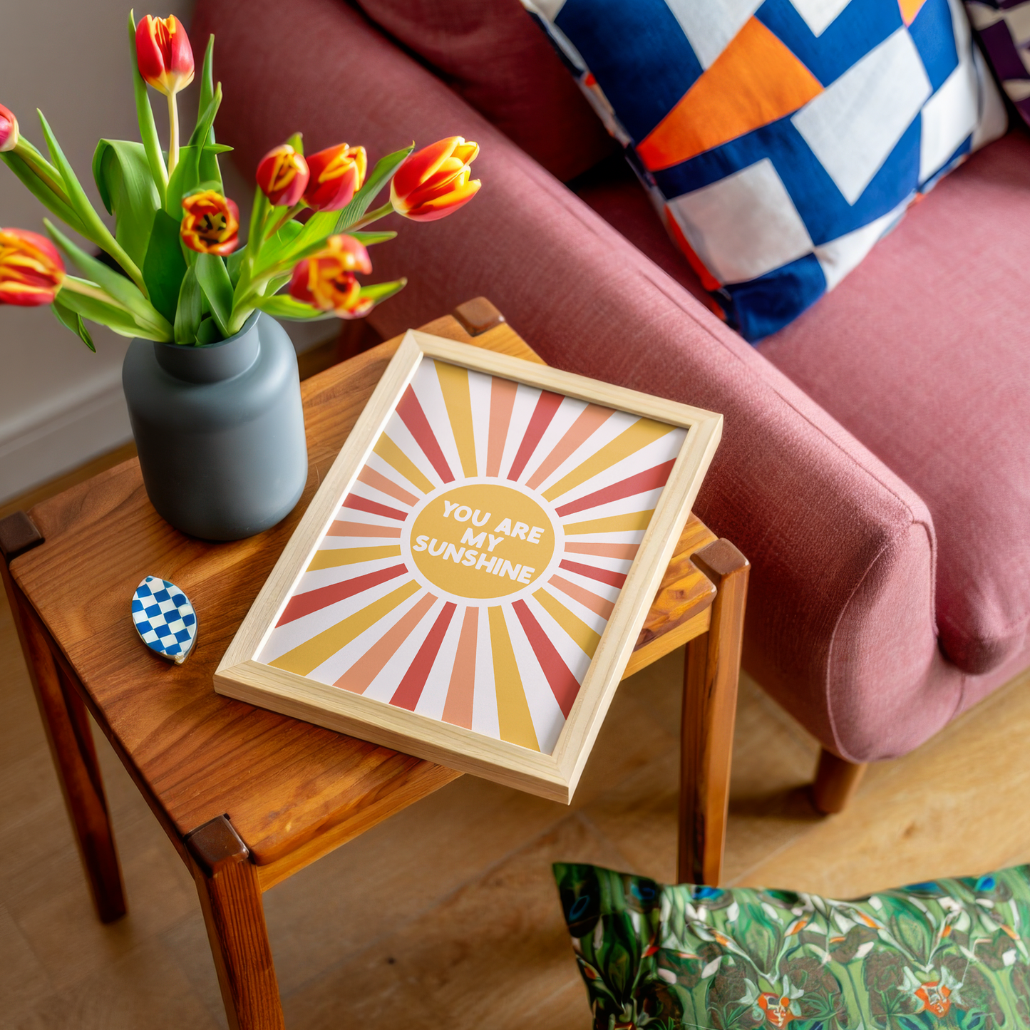 A fun quote print with text saying you are my sunshine, on a star burst background in orange yellow and red.