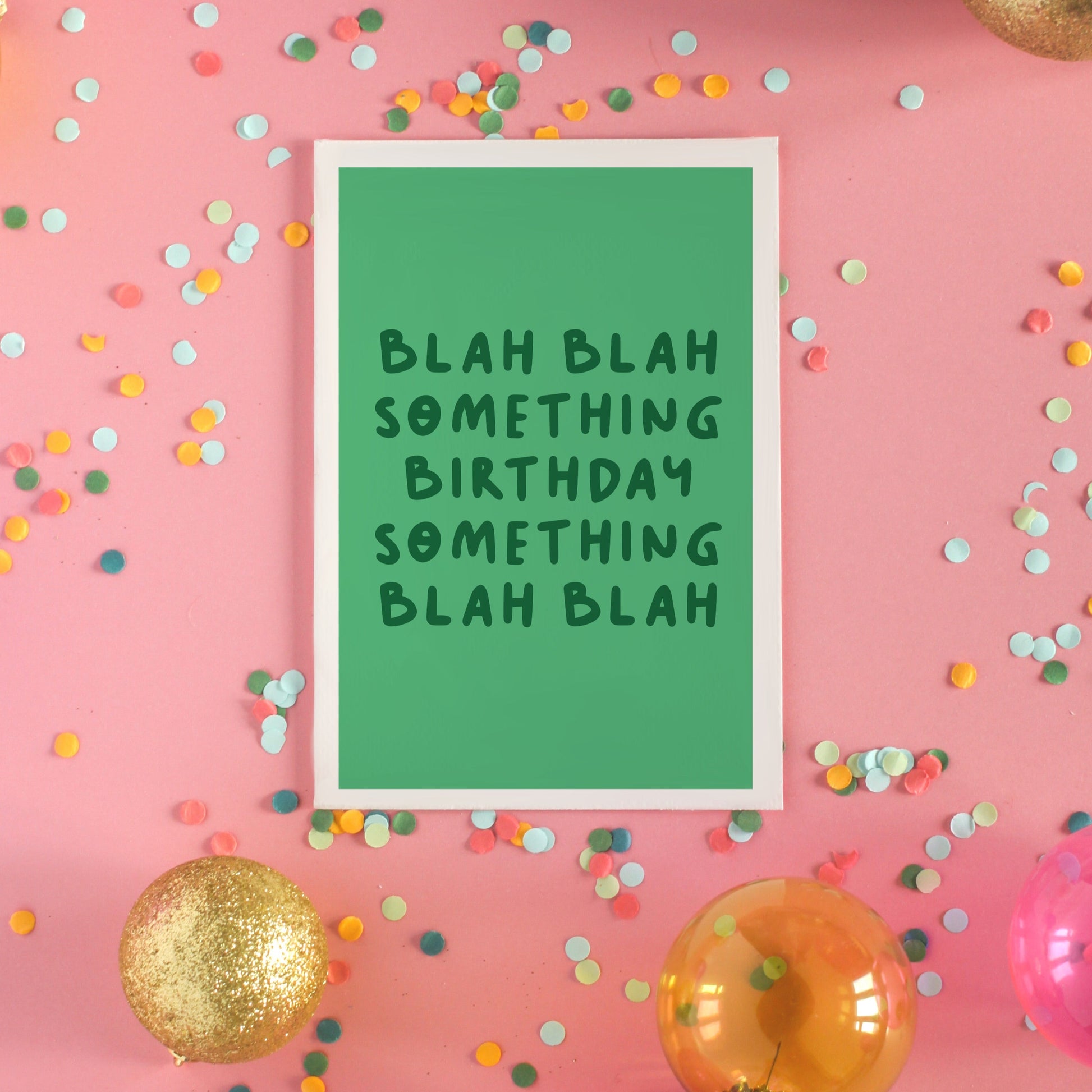 A birthday card, in green, saying blah blah something birthday something blah blah
