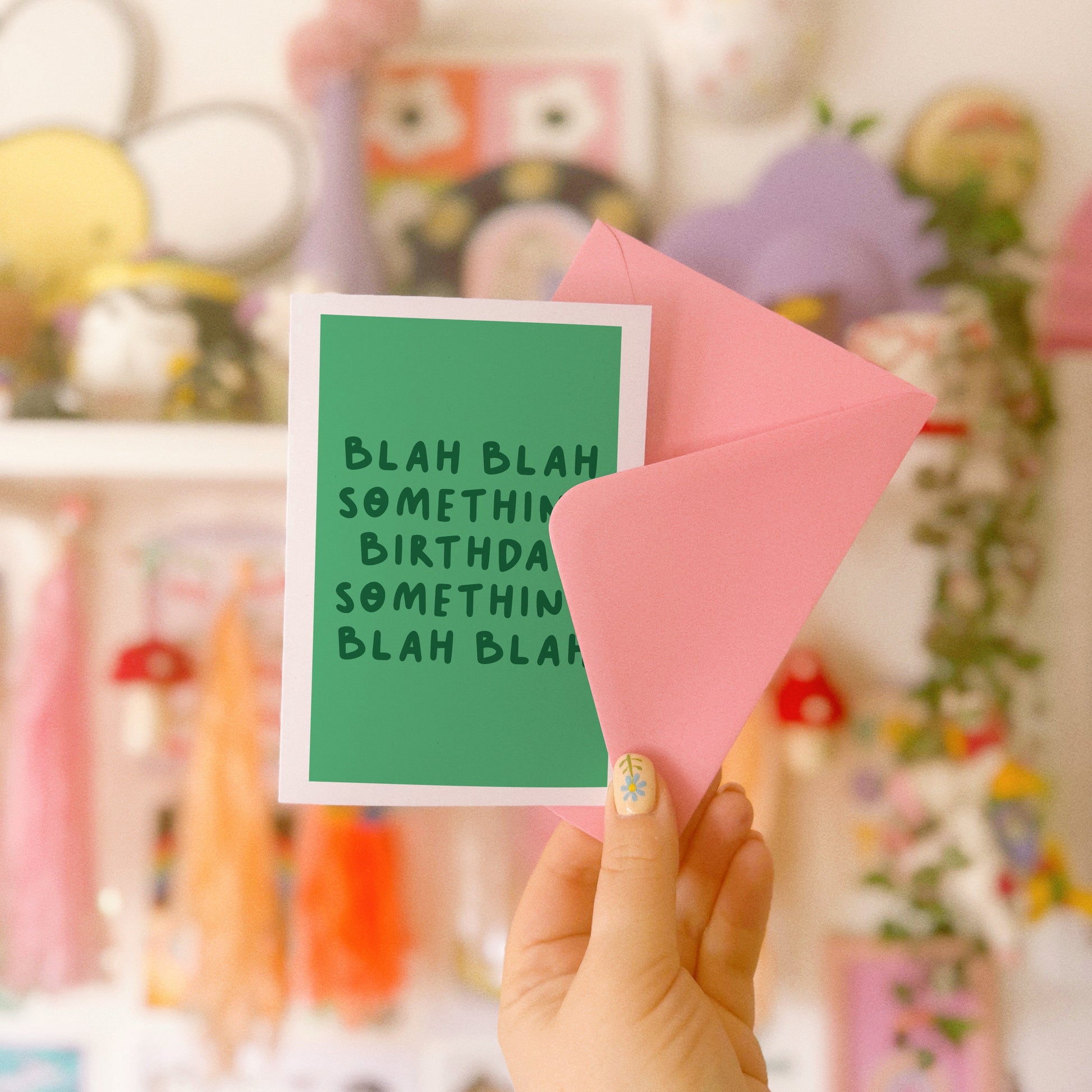 A birthday card, in green, saying blah blah something birthday something blah blah