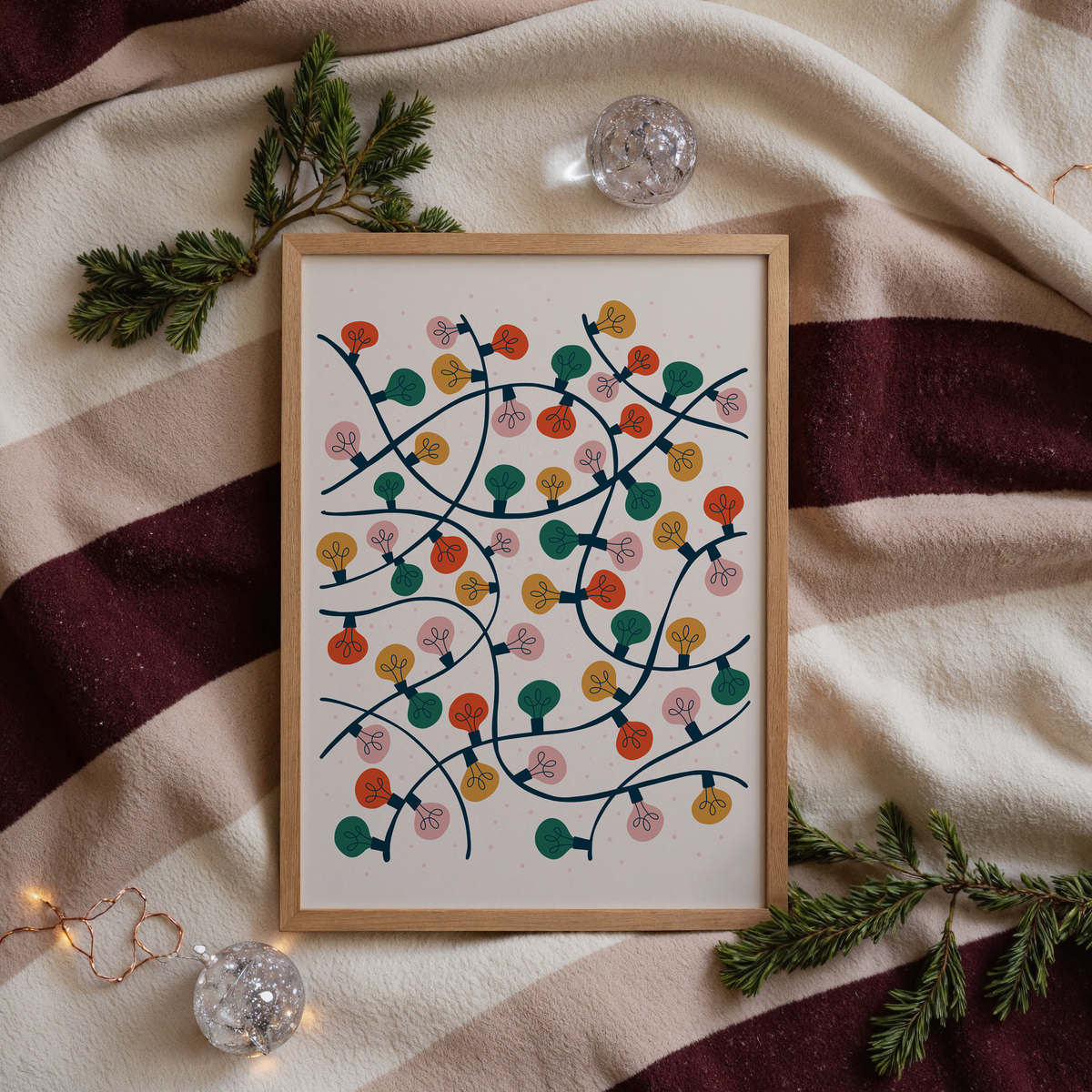A festively coloured art print featuring an illustration of lots of Christmas lights entangled altogether.