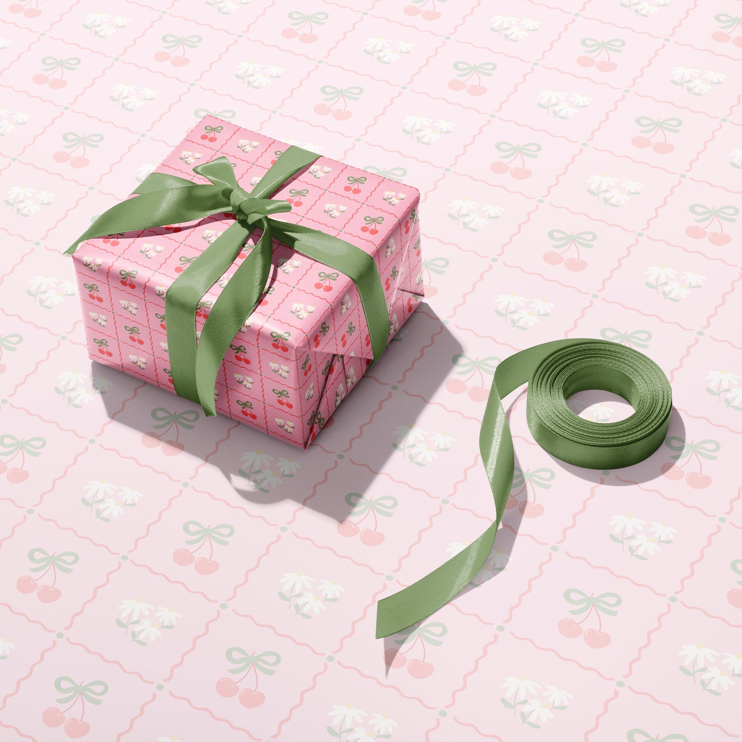 A pink patterned gift wrap, with cherries and daisies on.