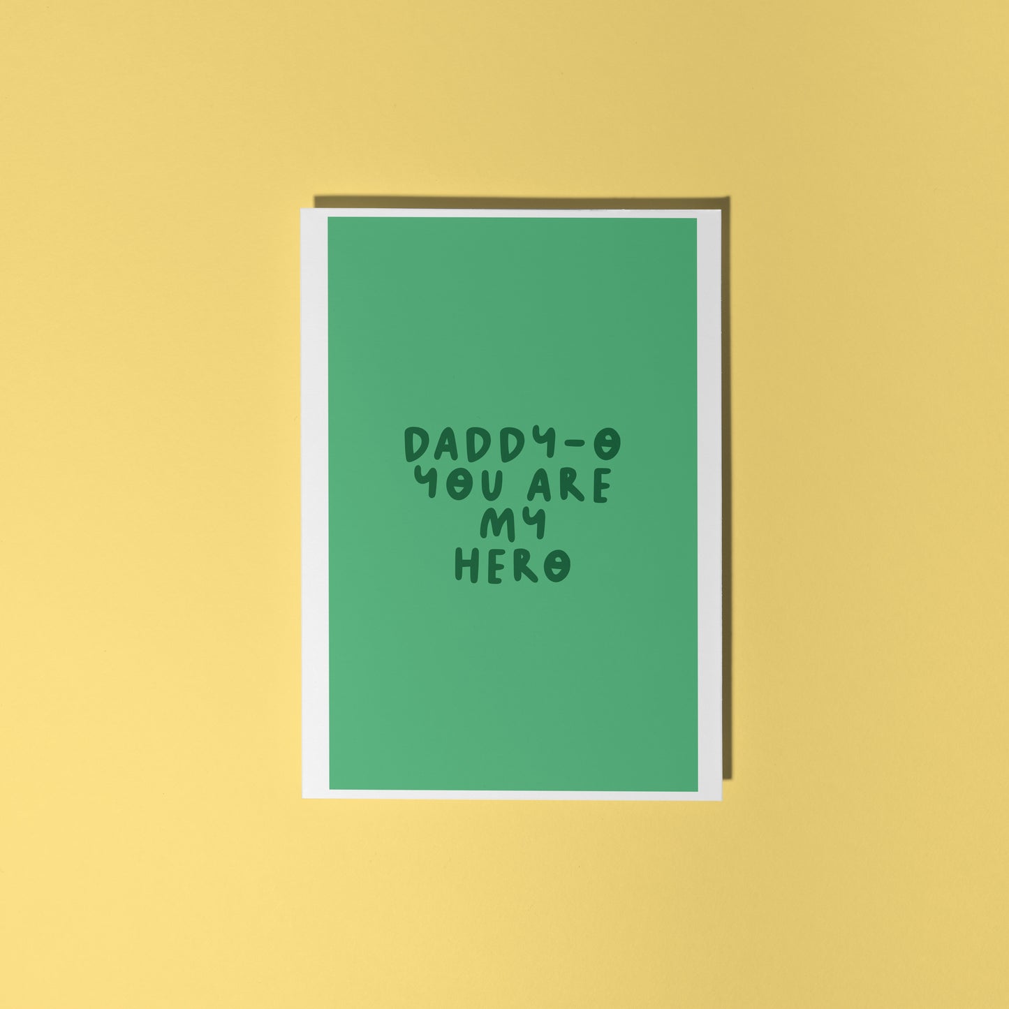 A green fathers day card, with text that reads 'Daddy-o you are my hero'.