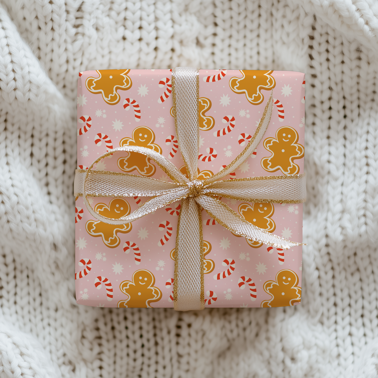 Gift box with gingerbread man pattern on a knitted surface